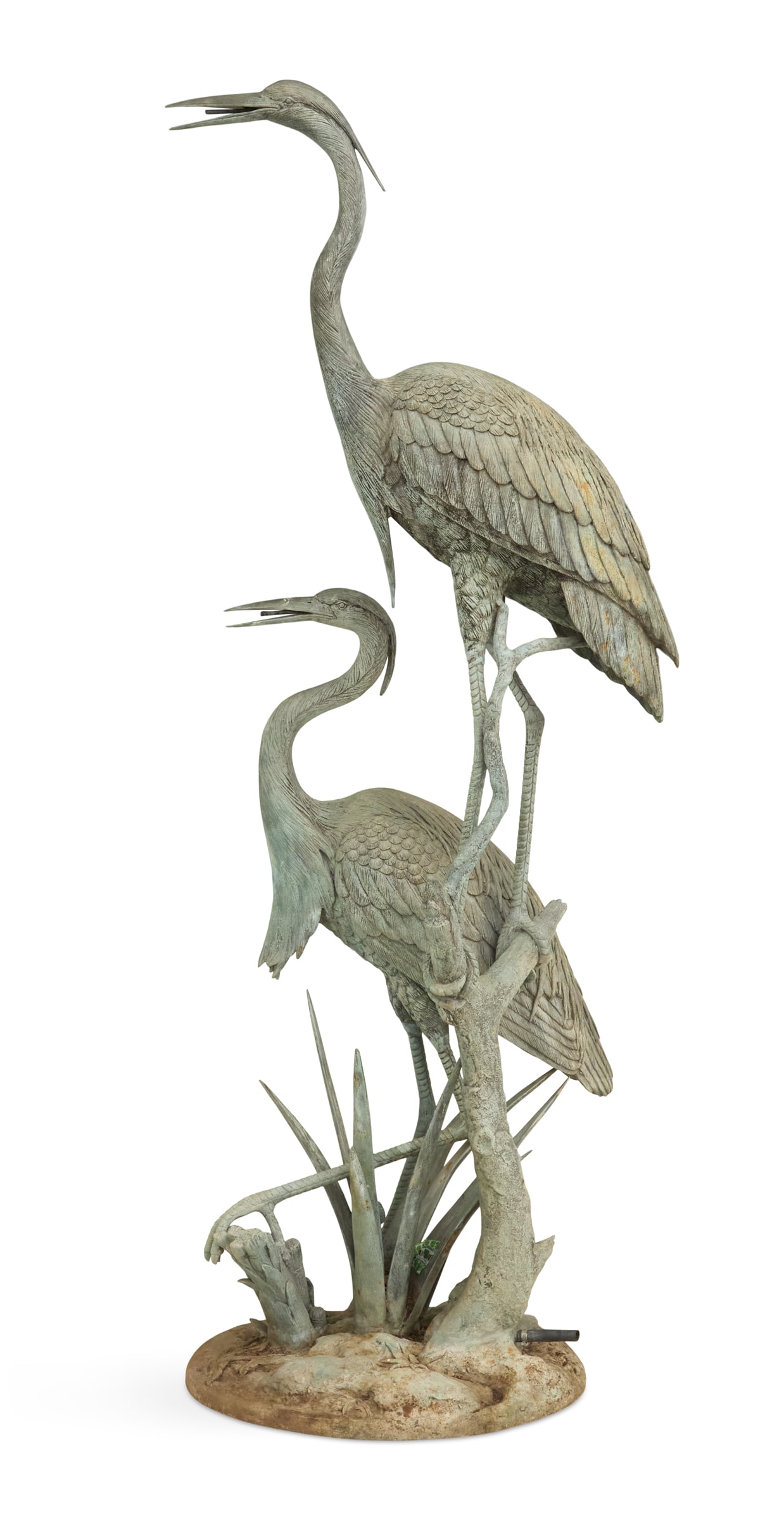 Bronze Egret Fountain: Bronze Egret Fountain comprised of two egrets, both piped to spout water from their bills, the taller one on a driftwood stump, above an integral circular base modeled with plants. h. 75-3/4", w.