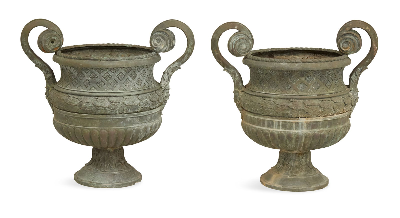 Pair of Bronze Garden Urns: Pair of Bronze Garden Urns in the Neoclassical Taste20th century, the rope-twist lip over a neck molded with a grid of lozenge-form medallions, the body with a border of acanthus leaves over vertical