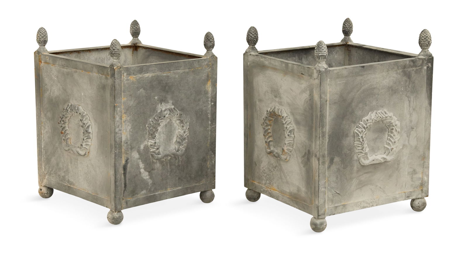 Pair of Painted Metal Tree Tubs: Pair of Painted Metal Tree Tubs21st century, in the neoclassical taste, the square planters with cone finials on each corner, and large wreath mounts on the sides, raised on bun feet.h. 22-1/2", w. 16
