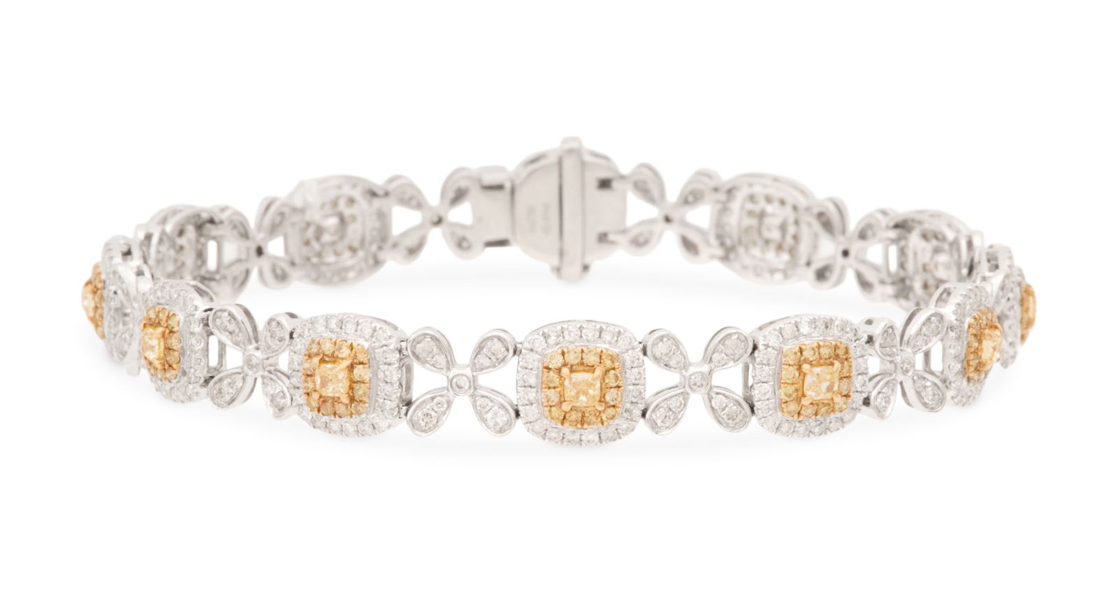 Yellow and White Diamond Bracelet: Yellow and White Diamond Bracelet 14k white gold, the bracelet mounted with cushion-cut yellow diamonds, each surrounded by a border of round-cut yellow diamonds and round brilliant-cut white