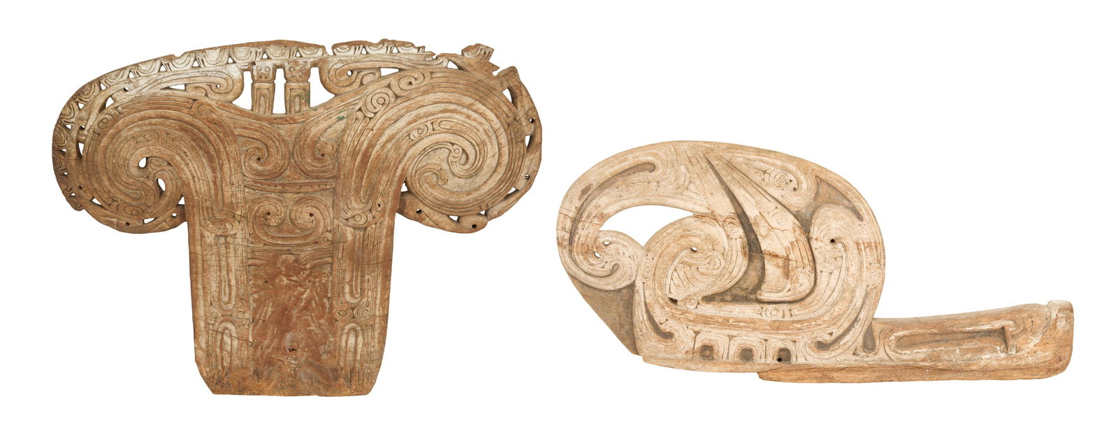 Two New Guinea Carved Wood Canoe Elements: Two New Guinea Carved Wood Canoe Elements Trobriand Islands, Papua, decorated with incised, low-relief scroll carving, including a lagim, a Massim canoe splash board with two scrolled sides, h.