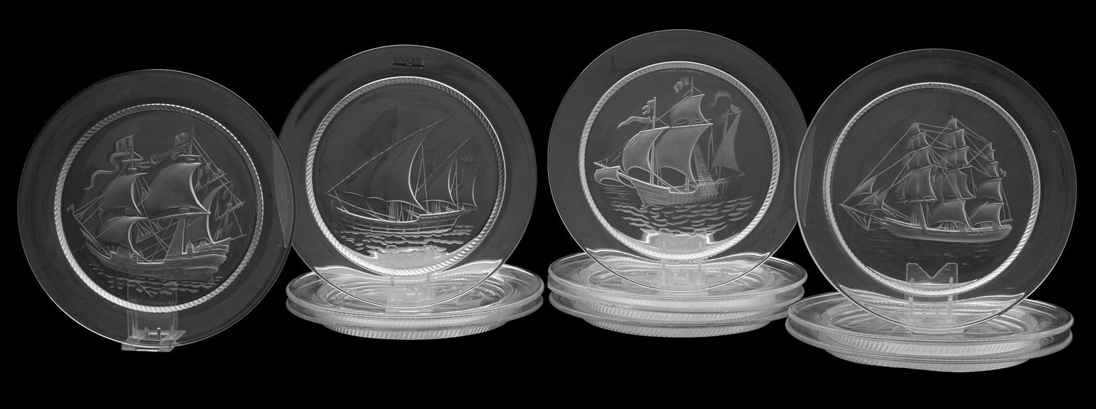 Set of Eleven Lalique Sailing Ship Plates: Set of Eleven Lalique Sailing Ship Plates20th century, the molded and frosted crystal salad/dessert plates decorated with views of sailing ships including Christopher Columbus's lead ship, the "Nina",