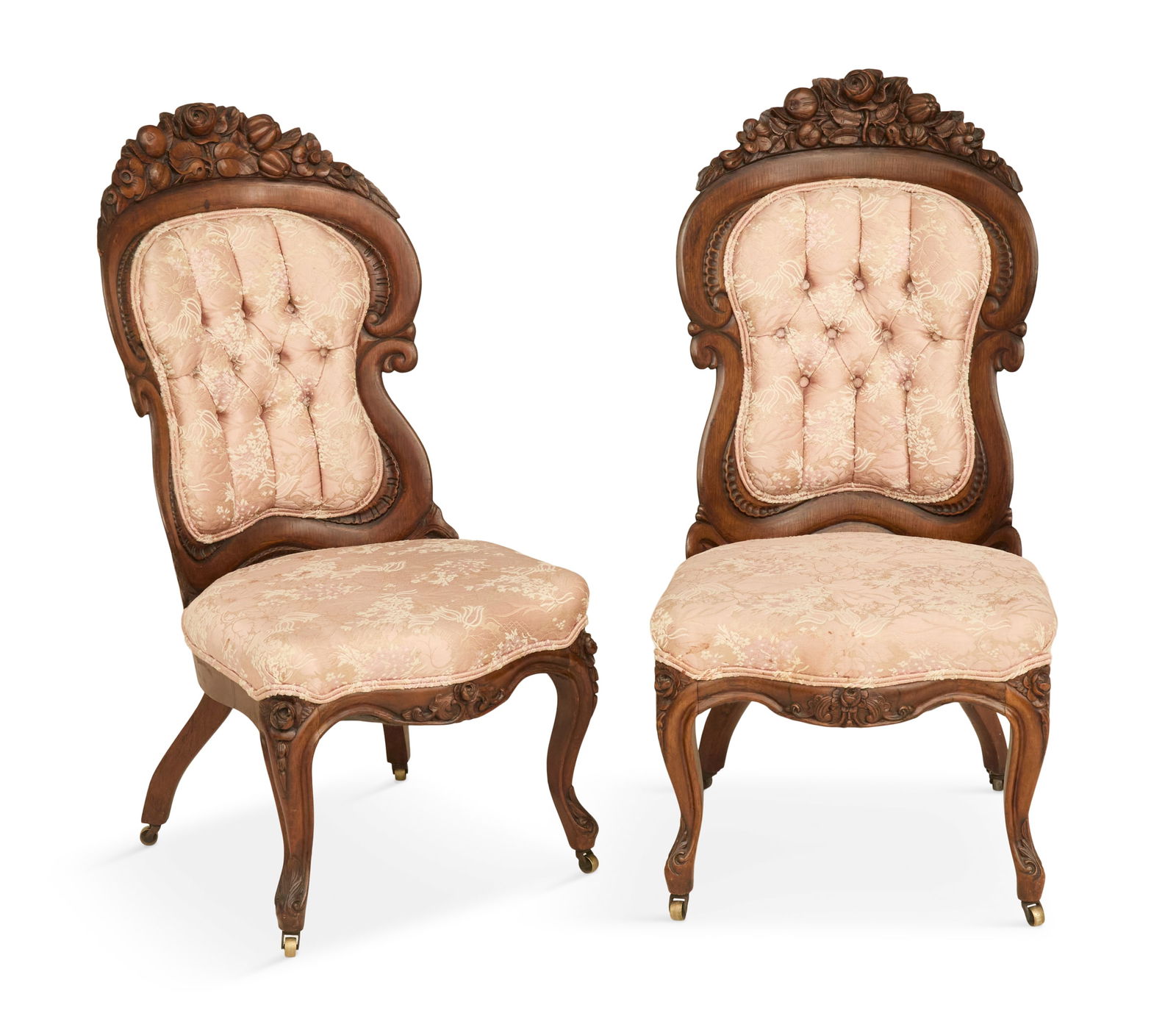 Pair of Rococo Revival Side Chairs: Pair of Rococo Revival Side Chairsca. 1850, the laminated rosewood chairs in the pattern referred to as "Henry Clay", each with an elaborate floral-carved crest, raised on cabriole legs.h. 38-1/2", se