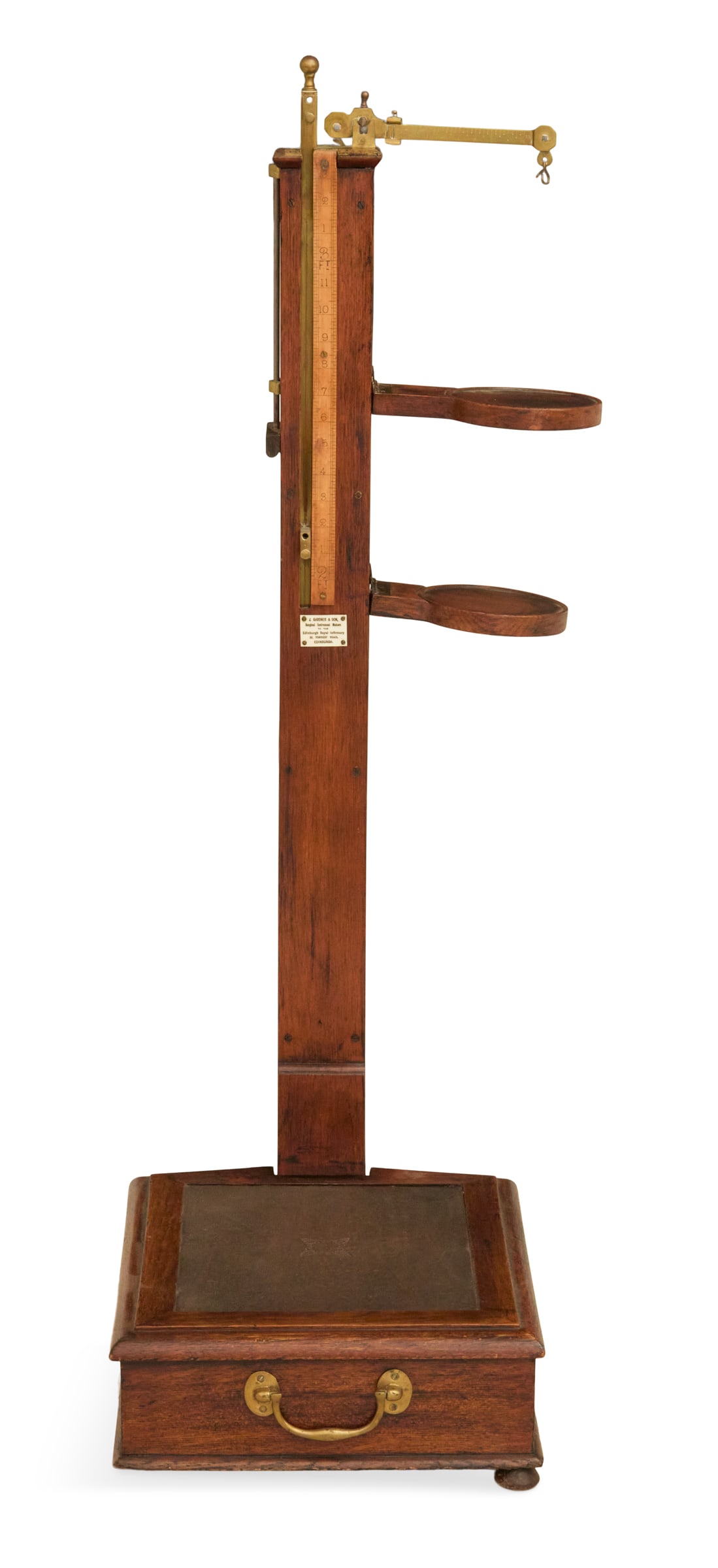 Scottish Oak and Brass-Mounted Jockey Scale: Scottish Oak and Brass-Mounted Jockey Scaleca. 1900, labeled "J. Gardner & Son, Edinburgh", the top fitted with a brass balance scale and two hinged circular shelves, the base with a framed standing p