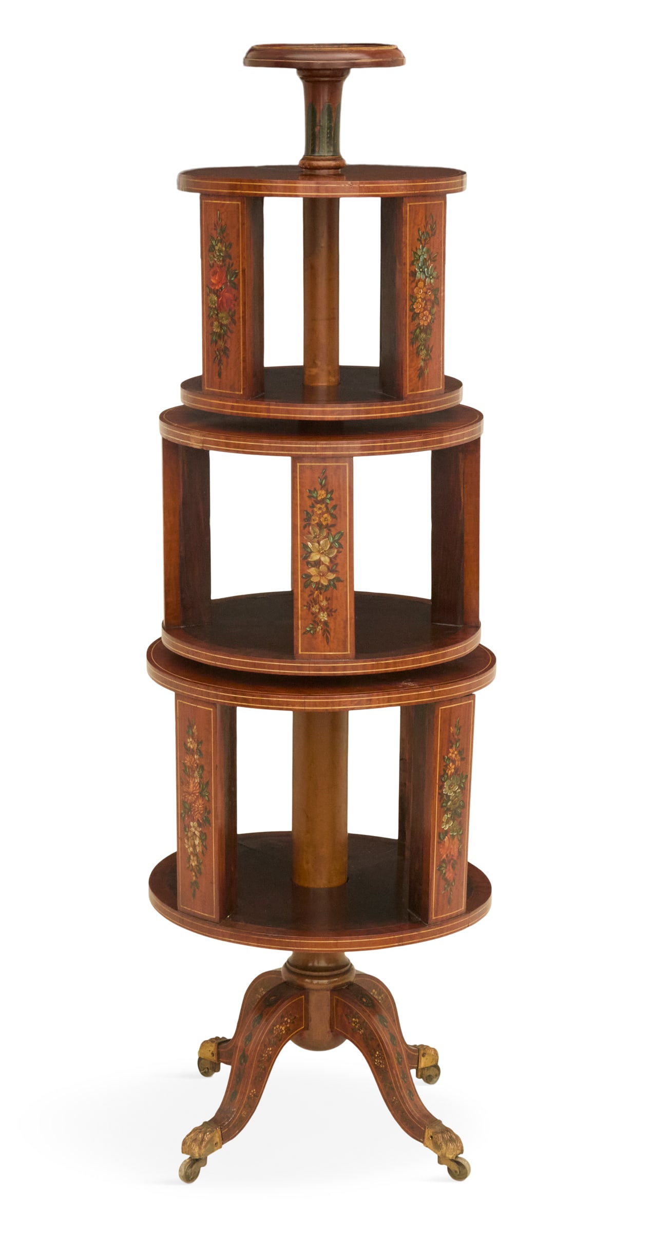 Edwardian Ribbon Mahogany Rotary Bookshelf: Edwardian Ribbon Mahogany Rotary Bookshelf ca. 1900, with three circular tiers set on a turned central standard with a four-legged base, the panels with floral-painted reserves. h. 56", dia. 18"