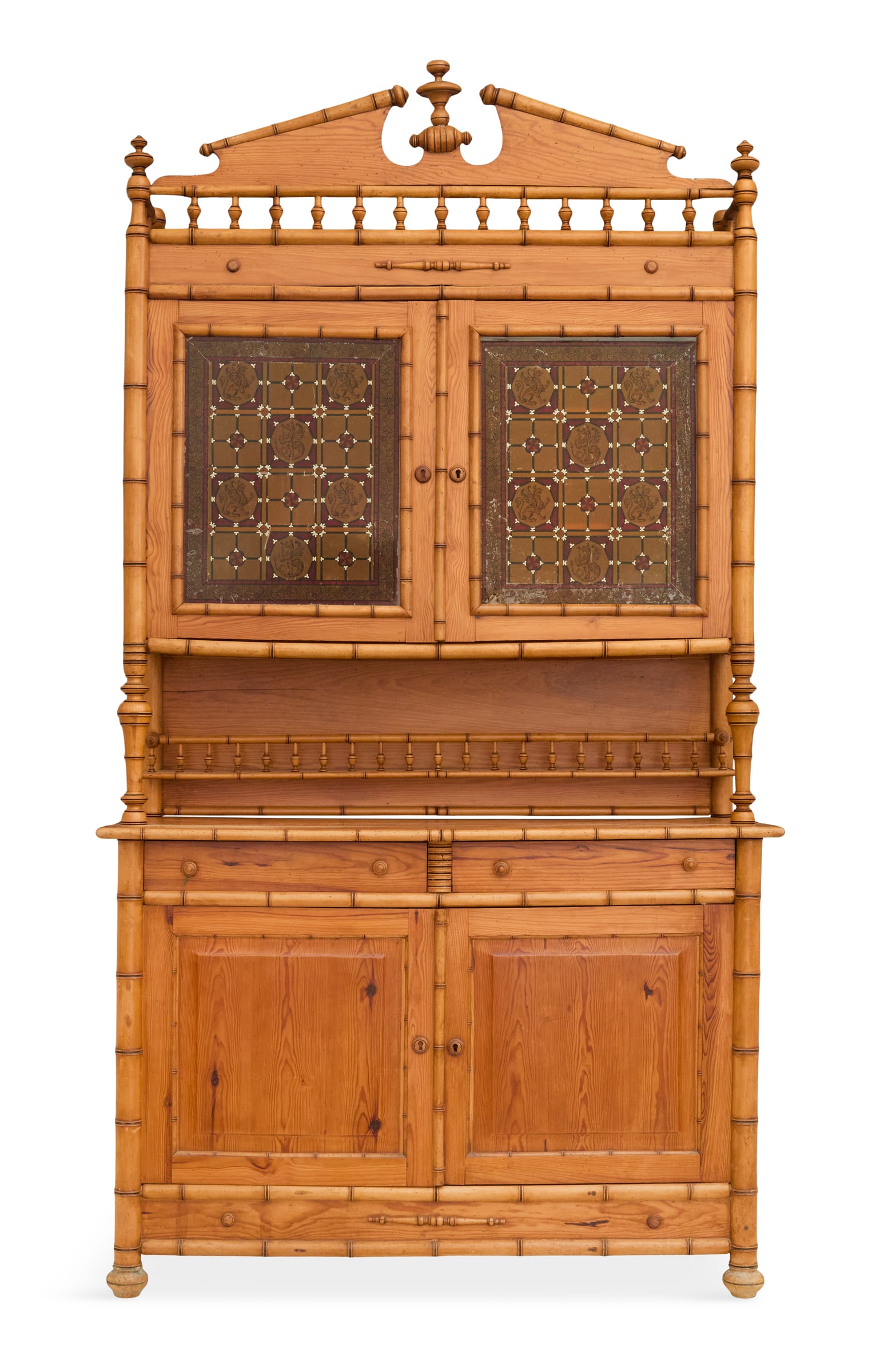 English Aesthetic Faux Bamboo and Pine Cabinet: English Aesthetic Faux Bamboo and Pine Cabinet late 19th century, the top with a slanted pediment centered by a turned finial, the upper case with a pair of eglomise framed doors over an open section