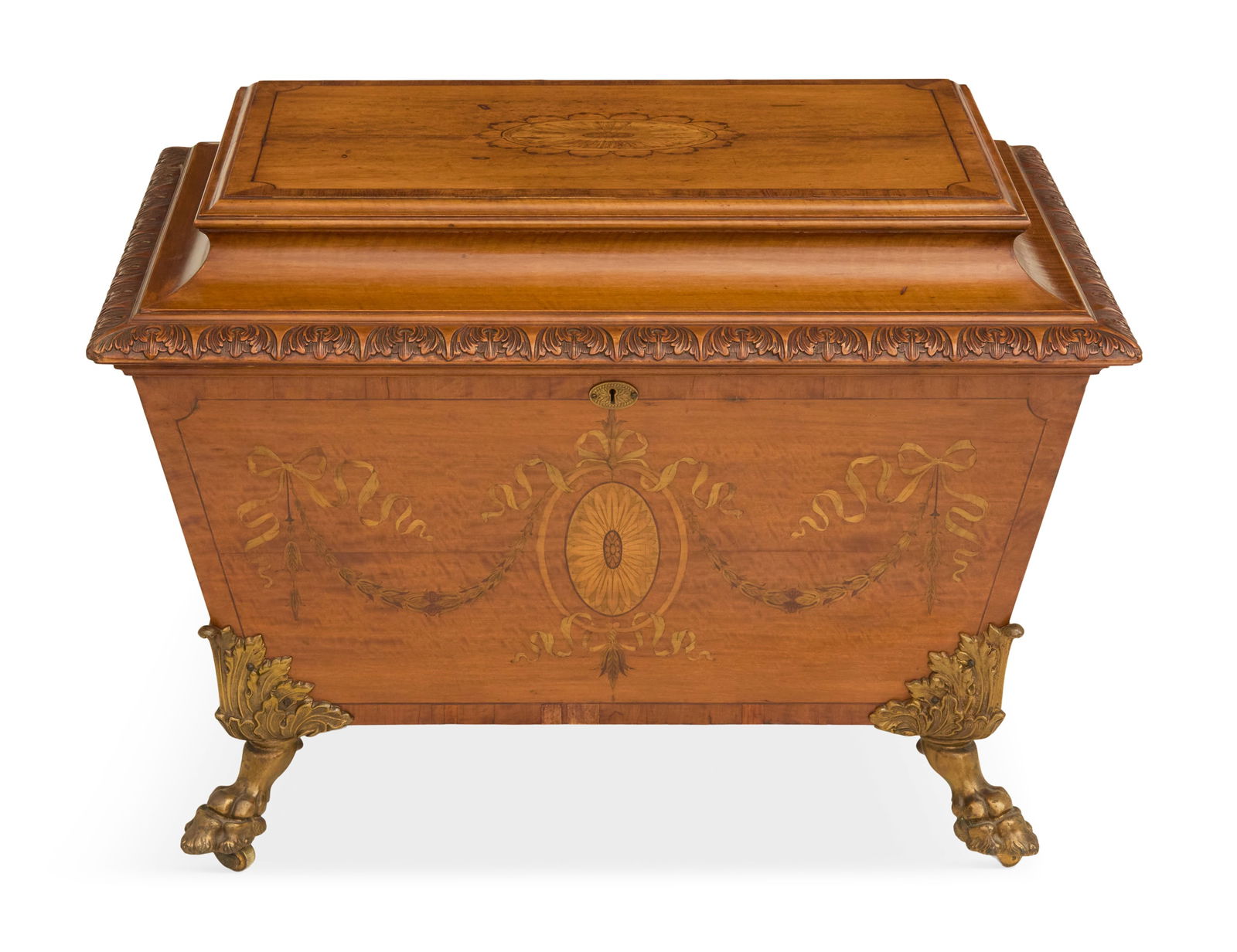 Regency Satinwood-Inlaid Cellarette: Regency Satinwood-Inlaid Cellarette 19th century, the banded top with a central inlaid medallion, with a leaf-carved gadrooned edge, the front with ribbon inlays and the sides with brass handles,