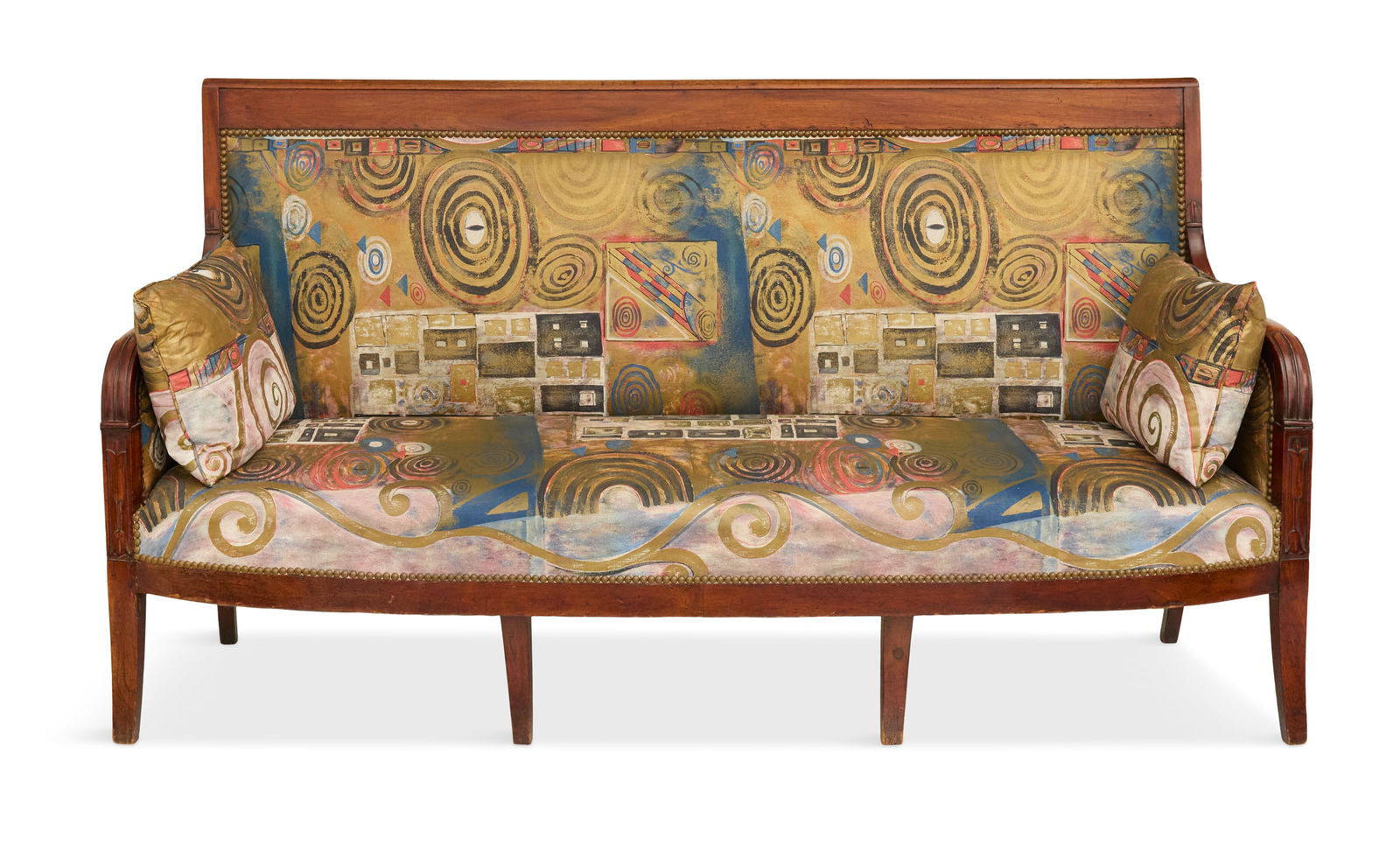 French Mahogany Settee in the Restauration Taste: French Mahogany Settee in the Restauration Taste second quarter 19th century, the bowfront settee with a rectangular back tablet, curved leaf-carved arms above fruit tablets bas-relief-carved with