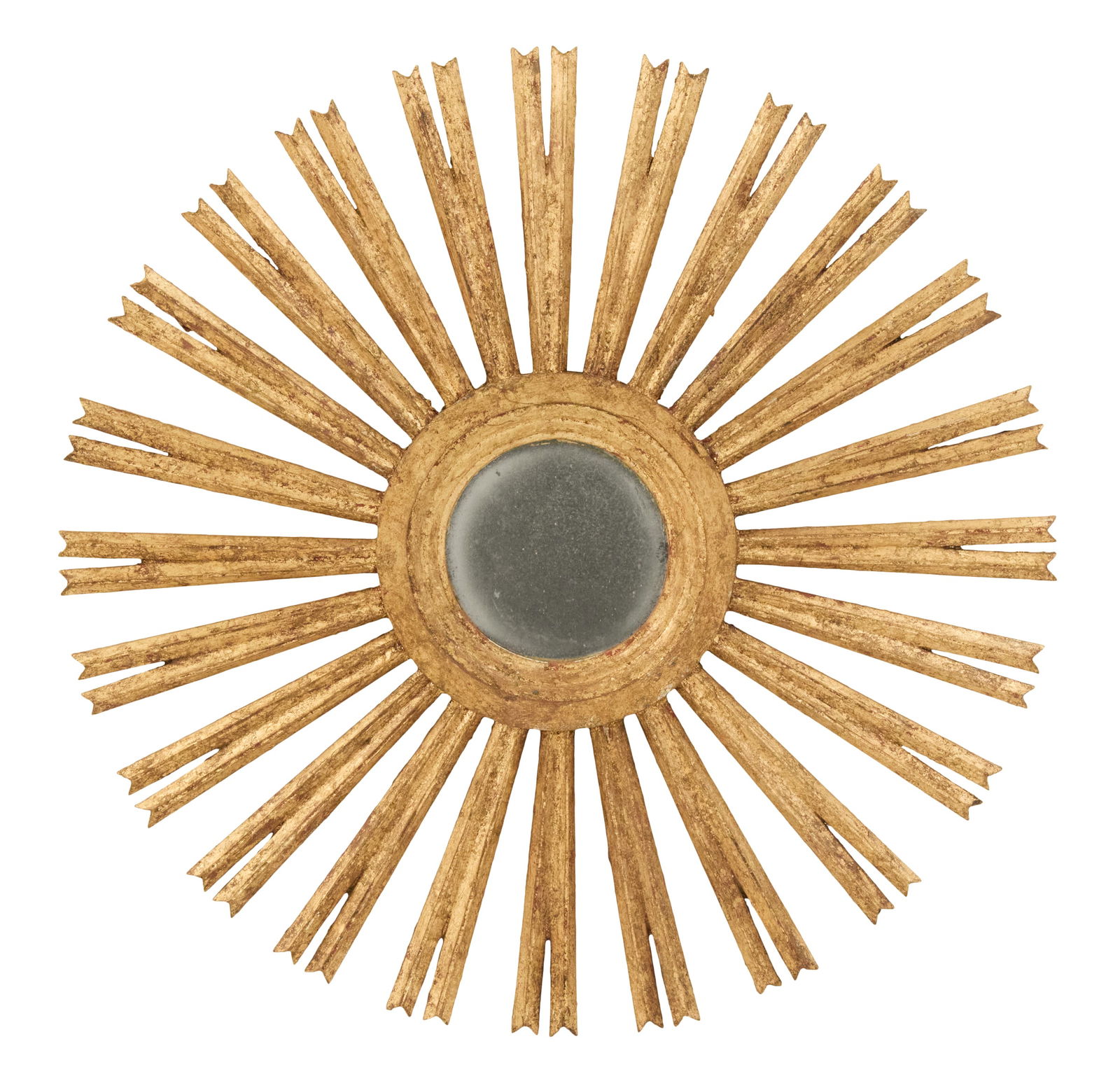 Giltwood Sunburst Mirror: Giltwood Sunburst Mirror likely Latin American, the circular mirror plate set into a molded giltwood surround, set with pairs of carved giltwood "rays". dia. 39-3/4"
