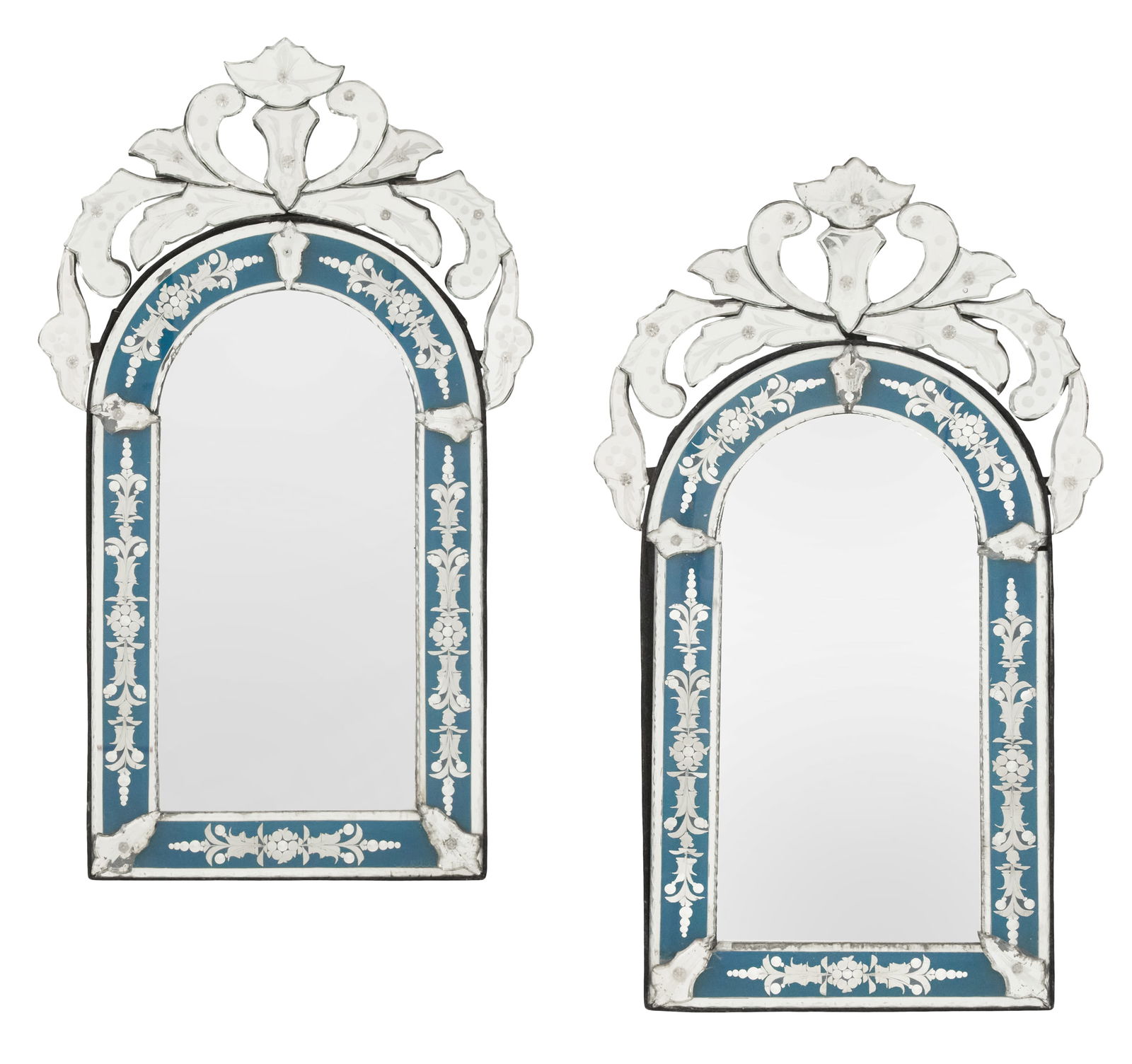 Pair of Italian Venetian Mirrors: Pair of Italian Venetian Mirrors mid-20th century, the pierced crests decorated with engraving over arched tops, and the blue-tinted surrounds engraved with sprays of flowers. h. 30", w. 17-1/4"