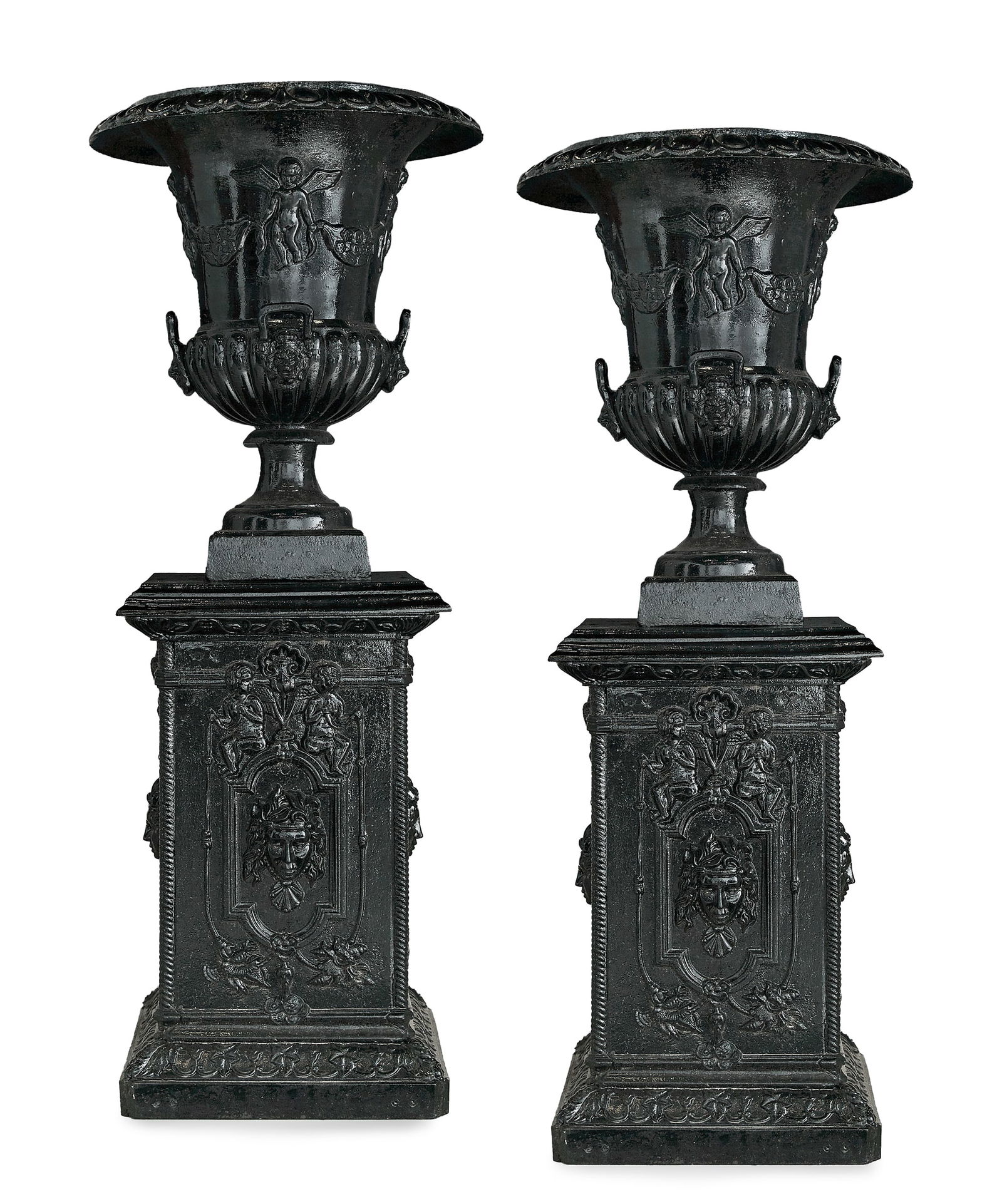 Pair of Neoclassical-Style Cast-Iron Garden Urns: Large Pair of Neoclassical-Style Cast-Iron Garden Urns on Pedestals each in two parts, the campana-form urns with flared egg-and-dart rims, the bodies adorned with putti and swags, and the handles