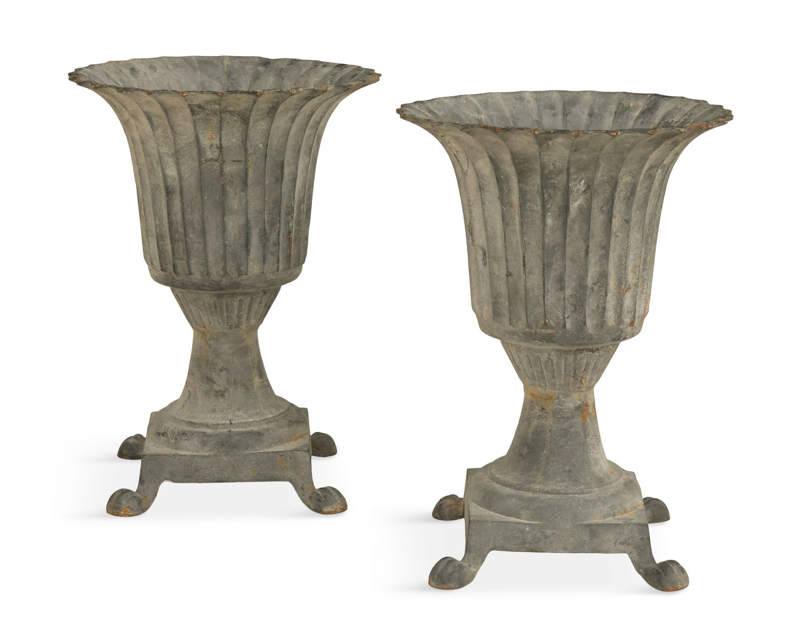 Pair of Neoclassical Cast-Iron Fluted Urns: Pair of Neoclassical Cast-Iron Fluted Urns 20th century, the tulip-form and fluted bodies raised on tapered bases with square plinths and molded paw feet. h. 24", dia. 17"