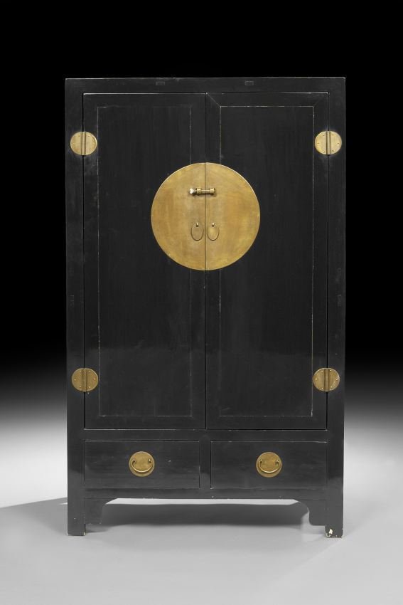 Chinese Black-Lacquered Elmwood Cabinet: Chinese Black-Lacquered Elmwood Cabinet, 20th century, with two doors over two drawers, and a moon-shaped face plate and mounts, h. 71", w. 42-1/2", d. 23".