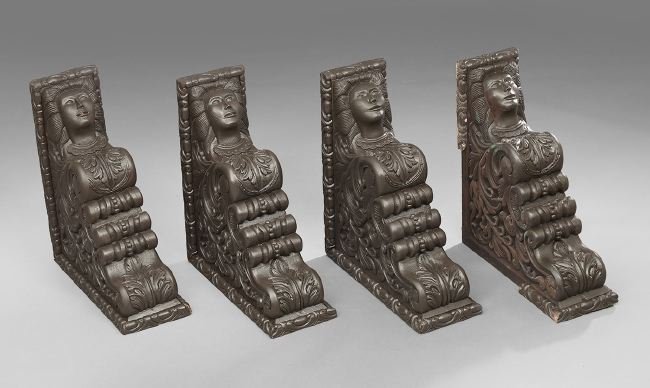 Four Latin American Carved Architectural Brackets: Suite of Four Latin American Masque-Carved Spanish Cedar Architectural Brackets, first quarter 20th century, in the Baroque style, h. 23-1/2", w. 9", d. 26-1/4".