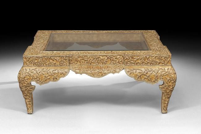 Large Anglo-Indian-Style Coffee Table: Large Anglo-Indian-Style Coffee Table, with inset glass in a frame base and apron depicting turning vines, leaves and critters, with a scalloped apron and cabriole legs, h. 20-3/4", w. 51", d. 51".