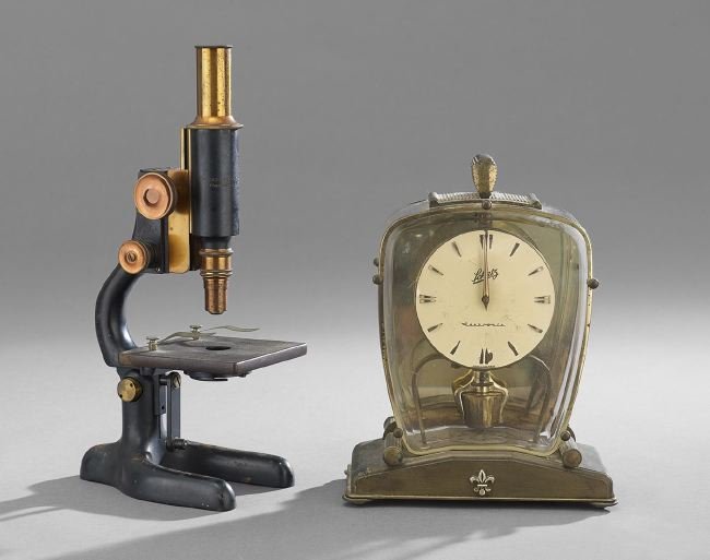Vintage Clock and Microscope: Vintage Clock and Microscope, consisting of a Schwartz brass and beveled glass electronic clock, of German origin, h. 10-1/4", w. 8", d. 4"; and a Bausch and Lomb enameled iron and gilt-brass microsco