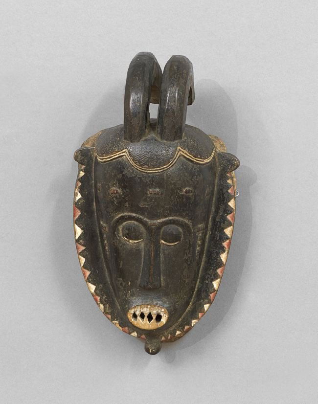 African Carved and Painted Mask: African Carved and Painted Mask, Yohure type, Ivory Coast, the mask with horns on top, h. 12-1/4", w. 7", d. 6-1/2".