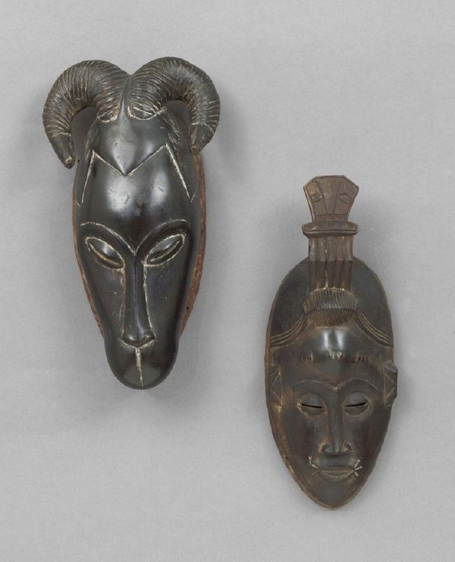 Two African Tribal Masks: Two African Tribal Masks, possibly Baule tribe, Ivory Coast, one appears to be a cross between a man and an animal, with human eyes and nose, h. 15", w. 8-1/4", the other depicting an elongated human