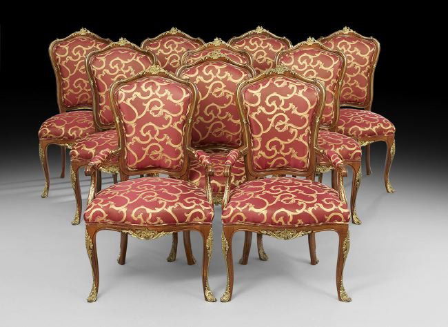 Louis XV-Style Ormolu-Mounted Dining Set: Fine Louis XV-Style Inlaid and Ormolu-Mounted Dining Set, comprised of an extension table with two additional 24-inch skirted leaves, h. 31", w. 51", l. 106" (without leaves), together with two armcha
