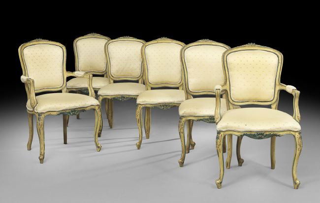 Six Louis XV-Style Polychromed Dining Chairs: Suite of Six Louis XV-Style Polychromed Dining Chairs, comprised of four sidechairs and two armchairs, each with a foliate- and floral-carved crest over a shaped back, upholstered in cream brocade ado