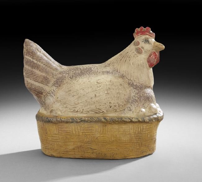 French Provincial-Style Terracotta Hen on Nest: French Provincial-Style Terracotta Hen on Nest, the paint-decorated hen depicted resting in a woven nest, h. 13", w. 14-1/2", d. 6-1/4".