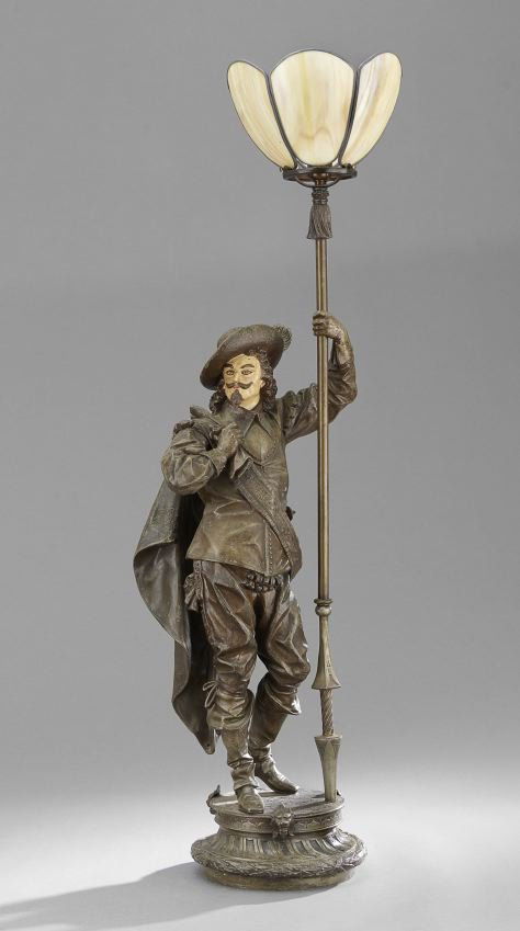 Spelter Newel Post Lamp in the Form of a Cavalier: Cast Spelter Newel Post Lamp in the Form of a Cavalier, ca. 1900, with a slag glass shade, h. 47", w. 13", d. 14".