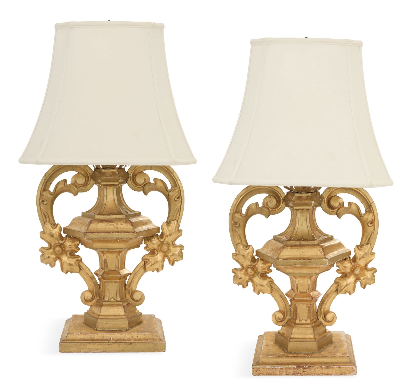 Pair of Italian Giltwood Urn Lamps: Pair of Italian Giltwood Urn Lamps 19th century and later, the Baroque-style tapered hexagonal urns with inset panels, mounted with scrolled handles accented with carved leaves and blossoms, on cove-m