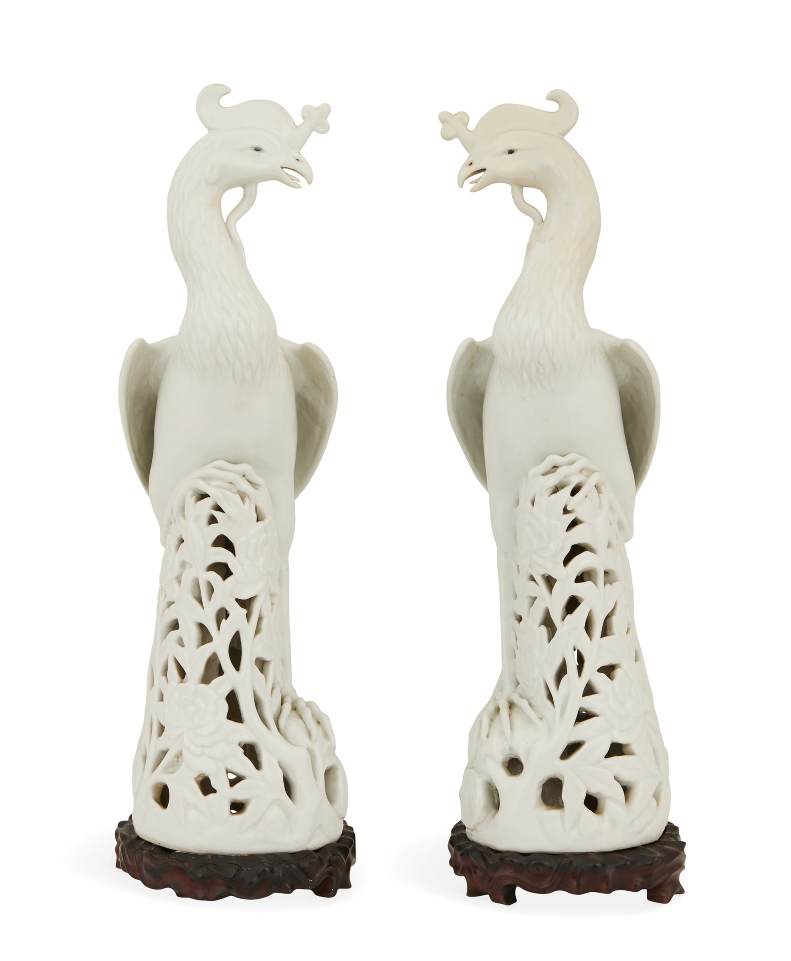 Pair of Chinese Blanc-de-Chine Phoenix Birds: Pair of Chinese Blanc-de-Chine Porcelain Phoenix Birds late 19th/early 20th century, the carefully modeled crested birds with flowing tail feathers and detailed feathers and feet, standing on pierced 