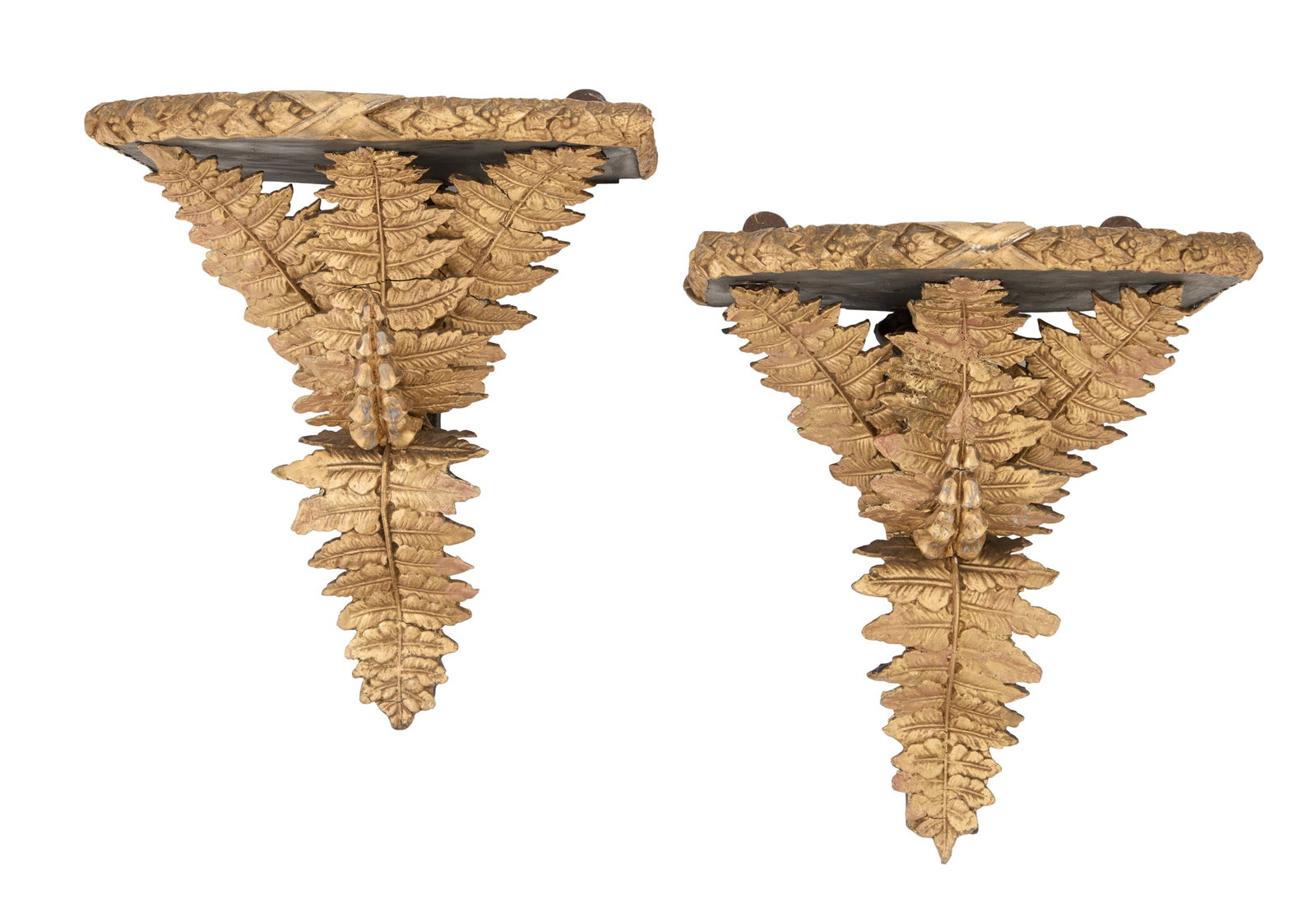 Pair of Giltwood and Ebonized Wall Brackets: Pair of Giltwood and Ebonized Wall Brackets early 20th century, set with ebonized shelves edged in giltwood foliage, the backplates decorated with giltwood curving ferns, with hollyhocks on the front.