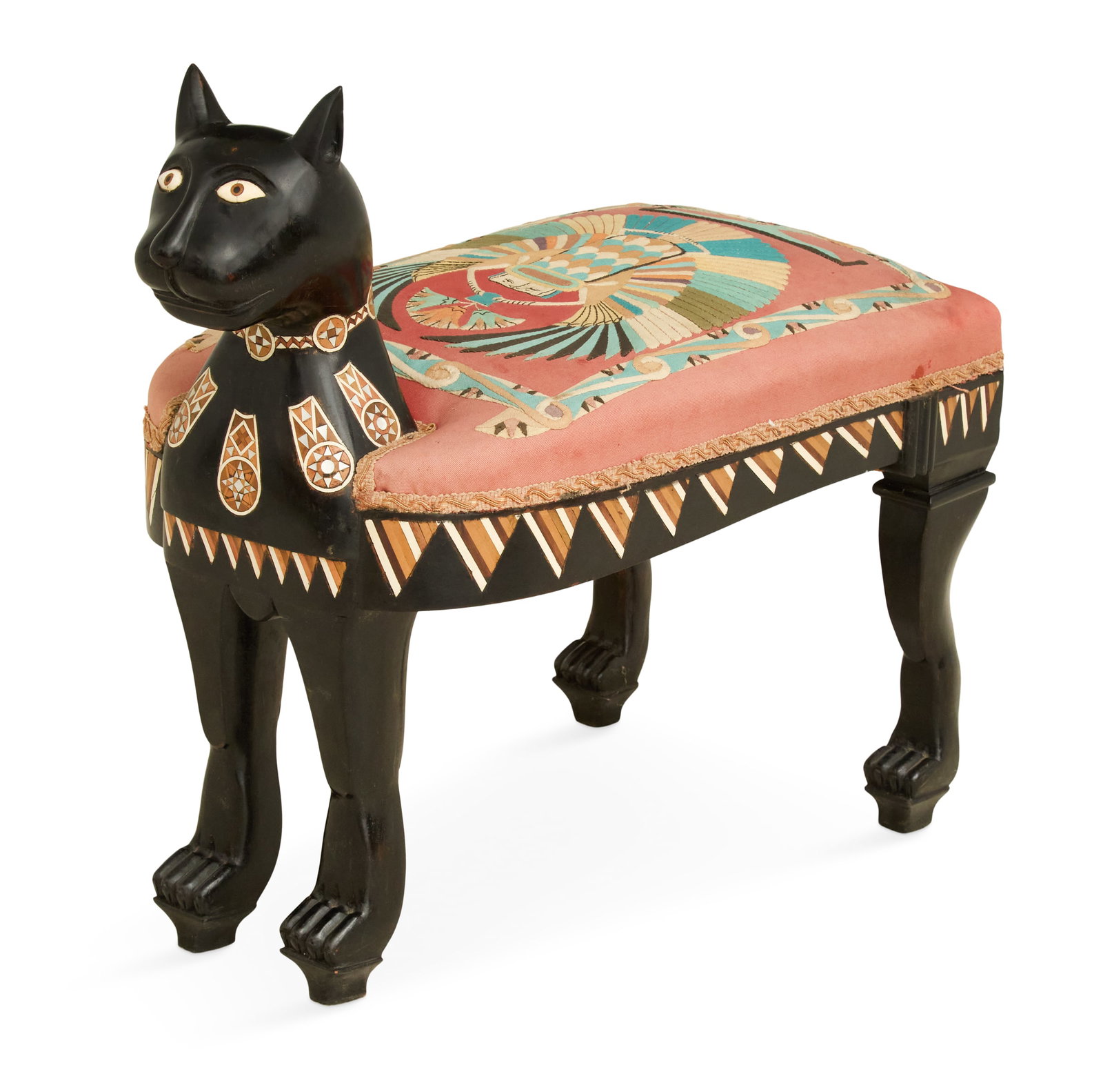 Egyptian Revival Ebonized and Inlaid Feline Stool: Egyptian Revival Ebonized and Inlaid Feline Stool first half 20th century, the cat dressed with an inlaid necklace, the padded seat covered with an appliqued fabric. h. 26", seat h. 17", w. 14-3/4", l