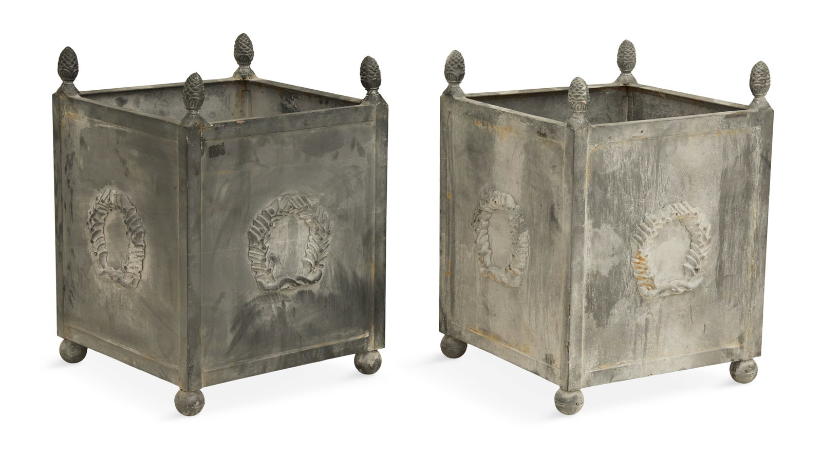 Pair of Metal Tree Tubs in the Neoclassical Taste: Pair of Metal Tree Tubs in the Neoclassical Taste contemporary, with cone-form finials, the sides with wreath-form mounts, on bun feet, the bottoms with drainage holes. h. 22-1/2", w. 16-1/2", d.