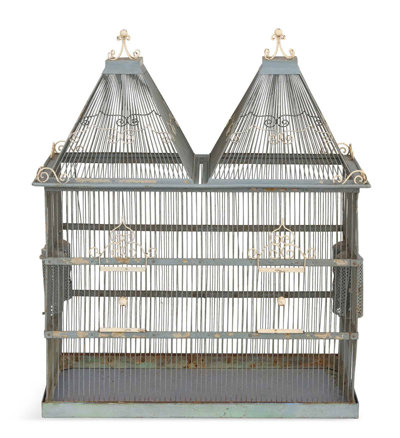 Enameled Metal Architectural Birdcage: Enameled Metal Architectural Birdcage 20th century, the cage with a pair of hipped roofs accented with white scrollwork, set with a pair of doors and two pairs of water and food receptacles. h. 36",