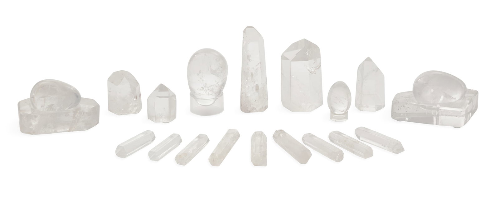 Collection of Twenty-Two Rock Crystal Objects: Collection of Twenty-Two Rock Crystal Objects including two rock crystal eggs in carved bases, h. 2-3/4", w. 4-1/2" to 5-1/2", d. 2-3/4" to 3", two rock crystal eggs on acrylic bases, h. 2-3/4" to 5",