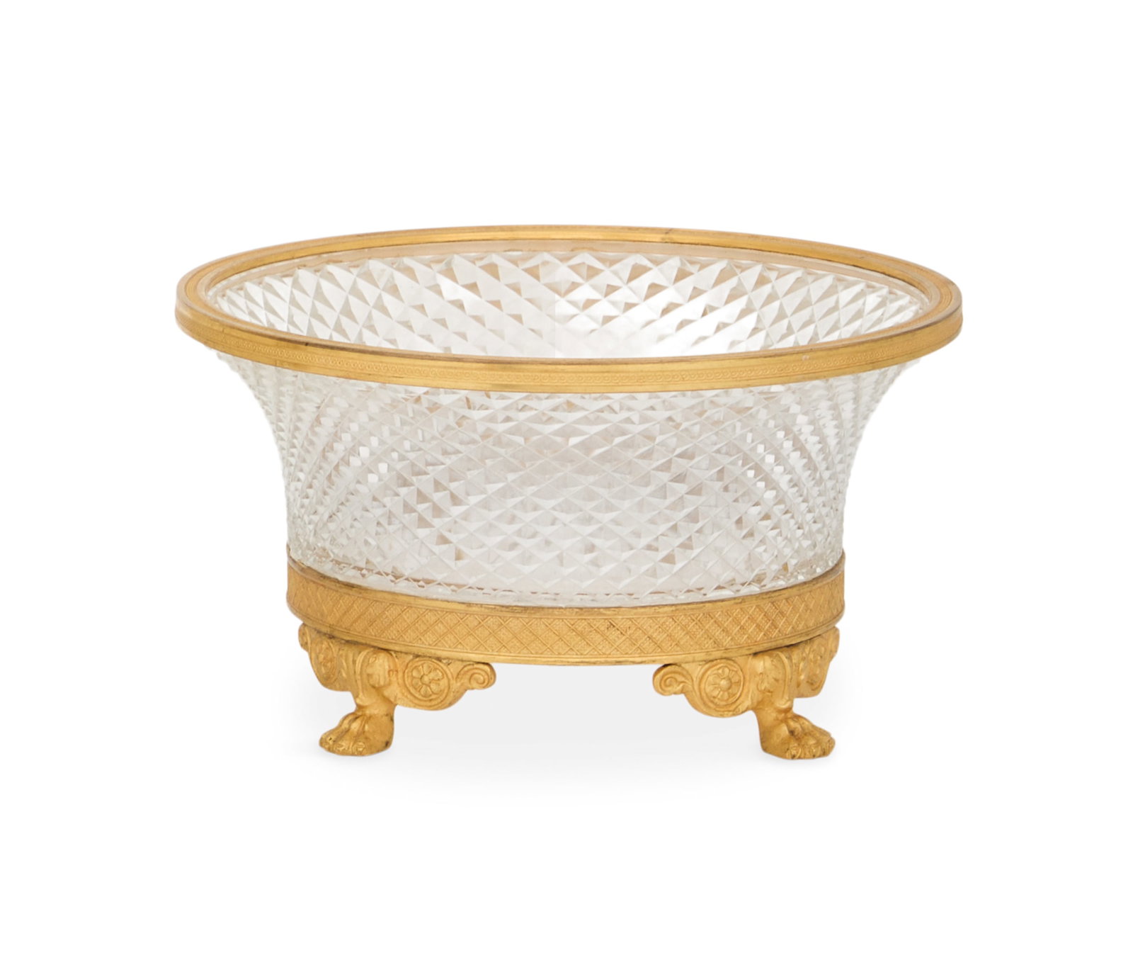 Bronze-Mounted Cut-Crystal Bowl: Bronze-Mounted Cut-Crystal Bowl mid-20th century, the diamond-point-cut centerpiece bowl mounted with engine-turned gilt-bronze fittings, raised on paw feet. h. 4-1/4", dia. 7-3/4" Provenance: Kevin S