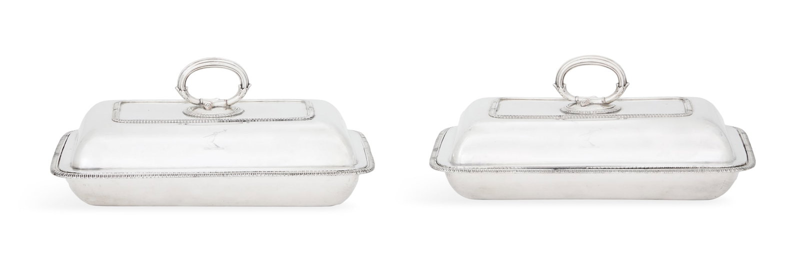 Pair of Regency Old Sheffield Plate Entree Dishes: Pair of Regency Old Sheffield Plate Entree Dishes first quarter 19th century, of rounded rectangular form with gadrooned rim and banding and acanthus-mounted reeded ring handle, engraved on the lid an