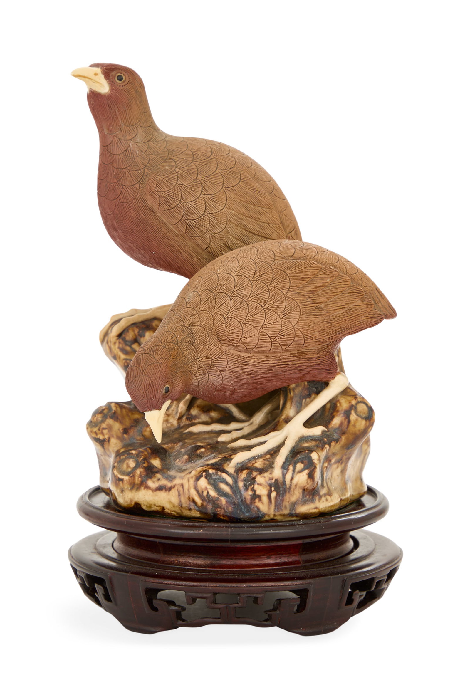 Chinese Shiwan Pottery Quail Group: Chinese Shiwan Pottery Quail Group late 20th century, the carefully molded quails on a brown-glazed base, raised on a carved wooden stand. h. 9-1/2", dia. 4-1/2" Provenance: The collection of