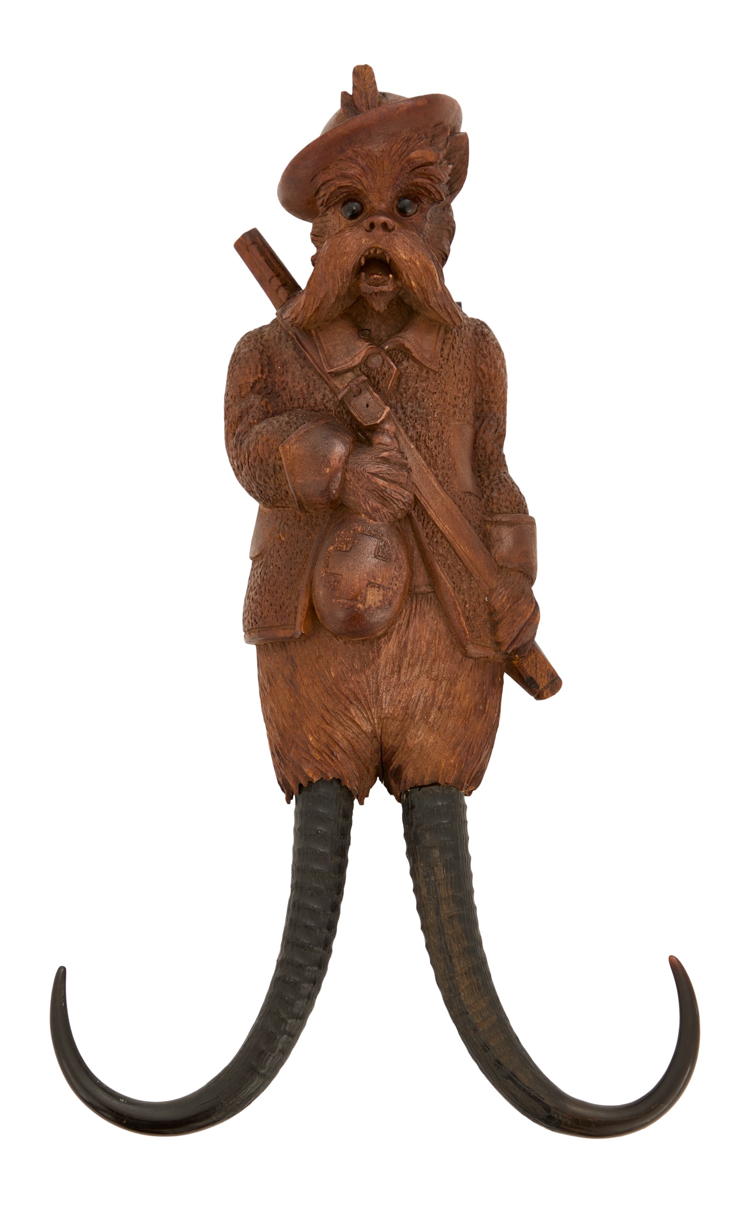 Rare Musical Black Forest Whip Hook: Rare Musical Black Forest Whip Hook ca. 1900, the carved walnut whip hook of a dog in Tyrolean dress, with glass eyes, with natural horns on the bottom, the back inset with a labeled C. Spiess music b