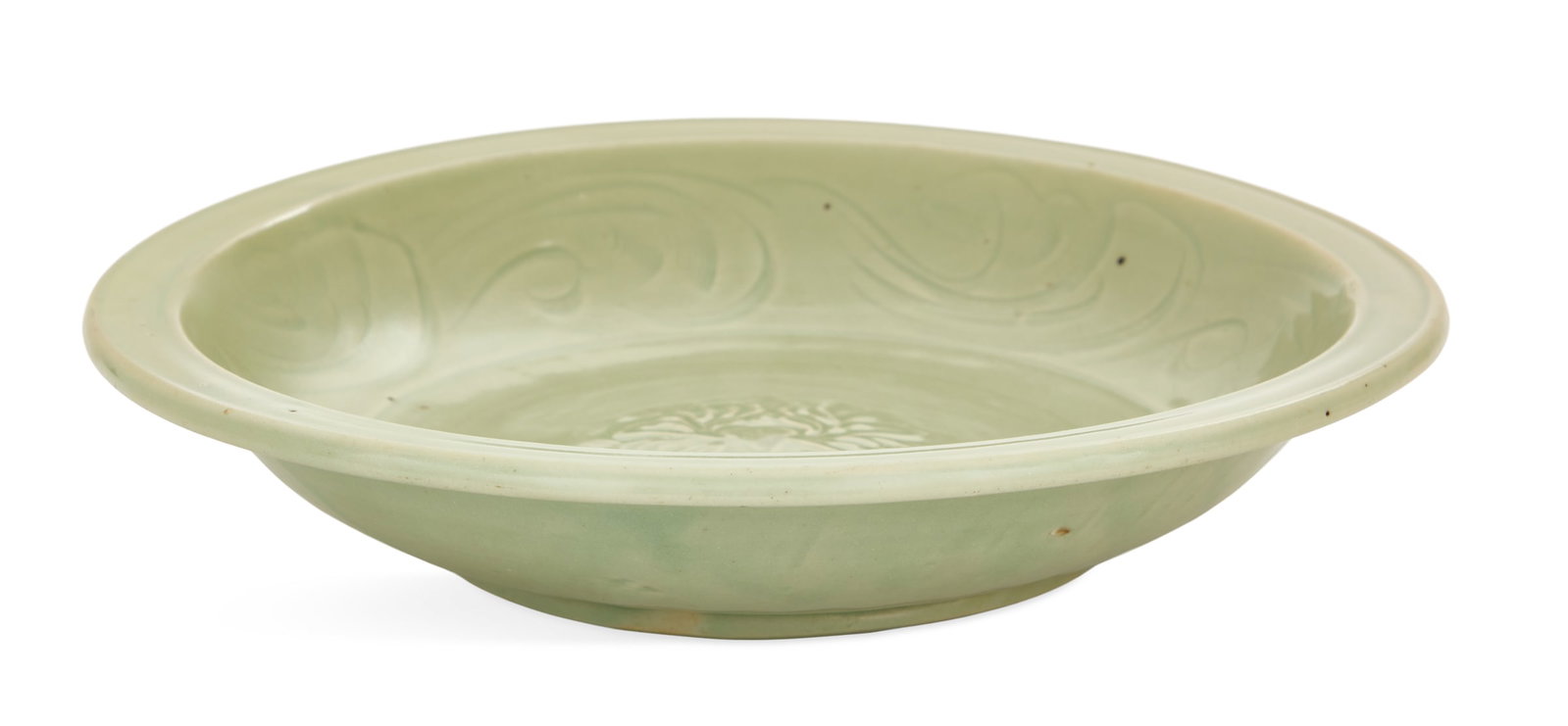 Chinese Carved and Molded Lanquan Pottery Coupe: Chinese Carved and Molded Lanquan Pottery Coupe likely Ming Dynasty (1368-1644), the center molded with lotus blossoms and the sides carved with scrollwork. h. 2-1/2", dia. 13" Provenance: The