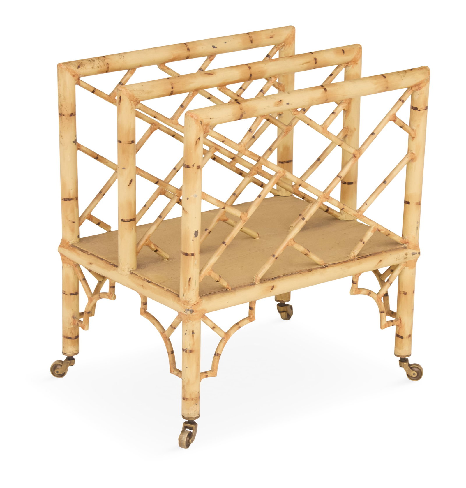 Faux-Bamboo-Painted Tole Canterbury: Faux-Bamboo-Painted Tole Canterbury 20th century, with faux-bamboo metal framed ends and center partition, raised on like legs ending in casters. h. 20", w. 18", d. 13-1/2"