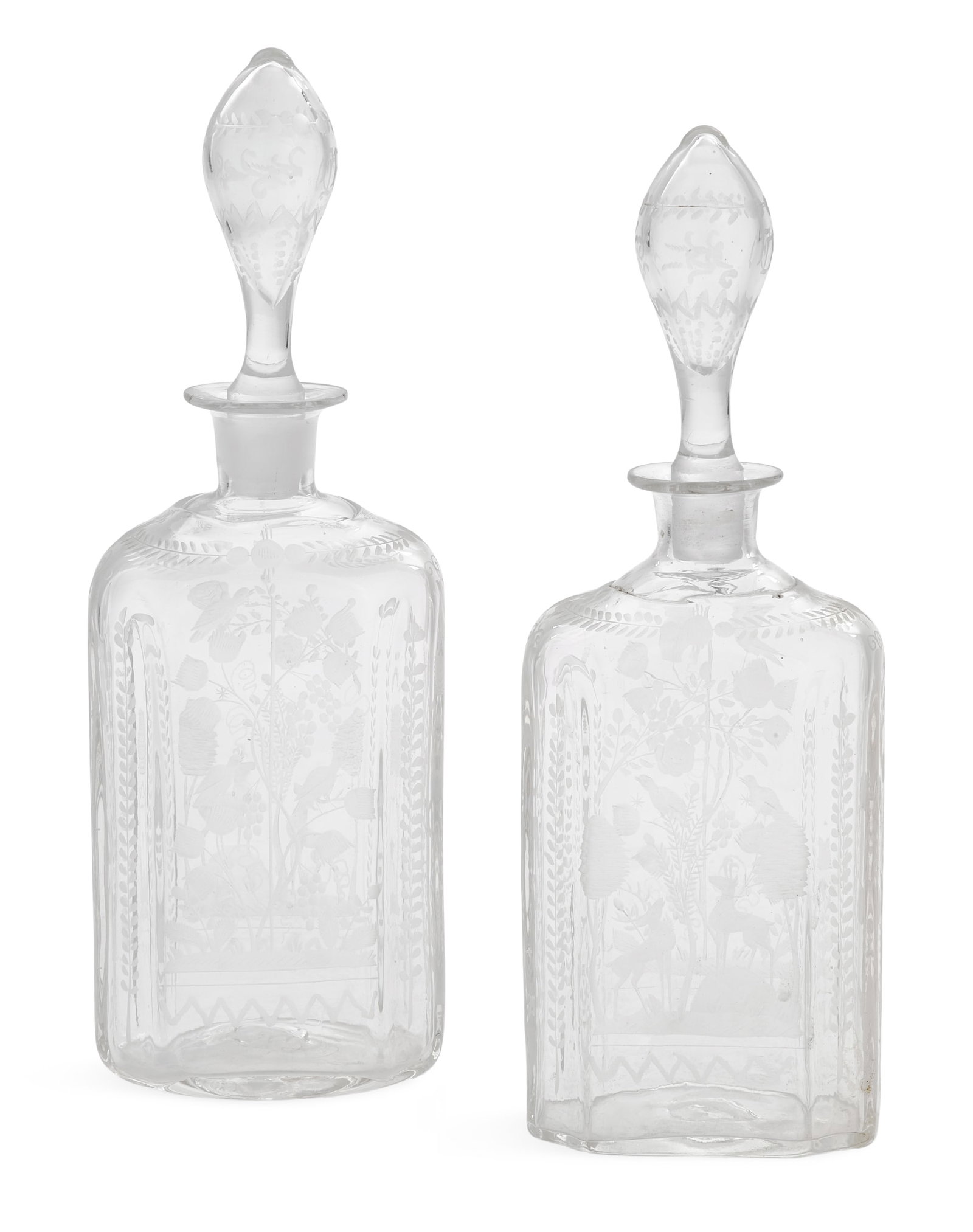 Pair of Bohemian Engraved Glass Decanters: Pair of Bohemian Engraved Glass Decanters 19th century, engraved with deer in a forest, trimmed with sprigging, with pontil marks. h. 11-1/2", w. 4", d. 2-3/4" Provenance: The Estate of Marian Cordill
