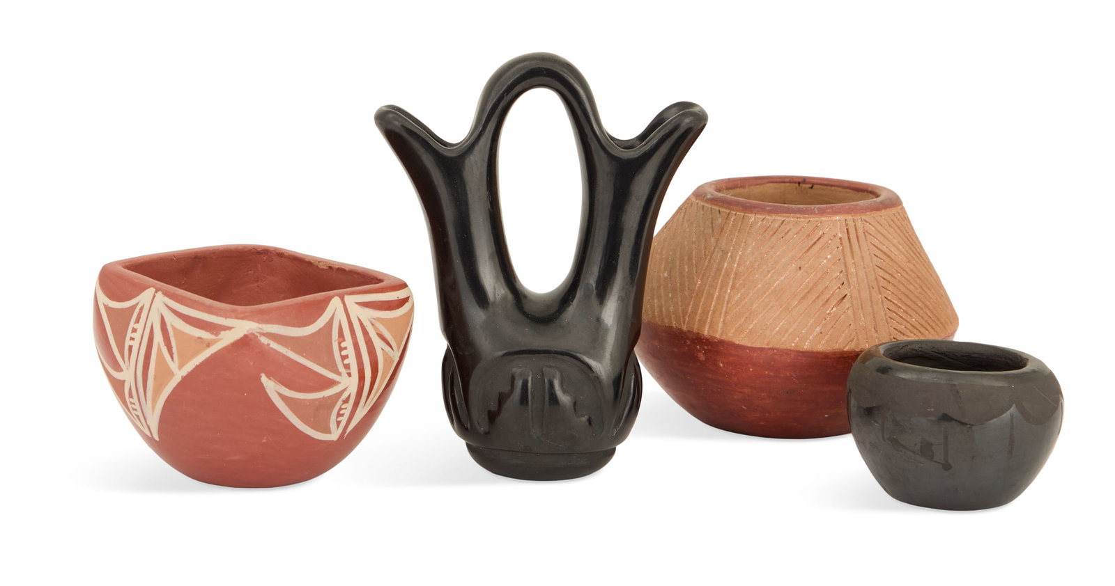 Four Pieces of Tewa Pueblos Pottery: Four Pieces of Tewa Pueblos Pottery including: a San Ildefonso squared olla, burnished red clay with white and red slip rain and moon banding, h. 2-1/2", w. 3-1/2"; a Legoria Tafoya (Santa Clara, 1911