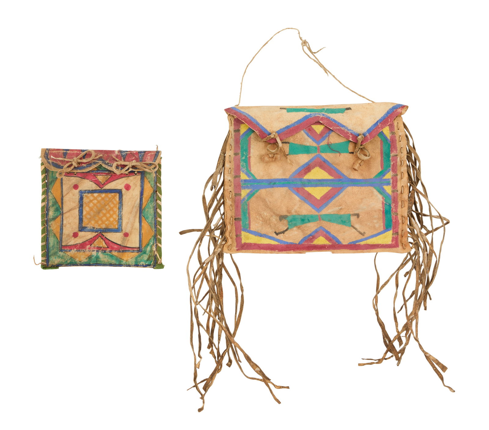 Two Native American Rawhide Flat Case Parfleches: Two Native American Rawhide Flat Case Parfleches 19th century, including a fringed example with geometric decoration, probably Blackfeet, and a smaller example with a yellow grid center, probably