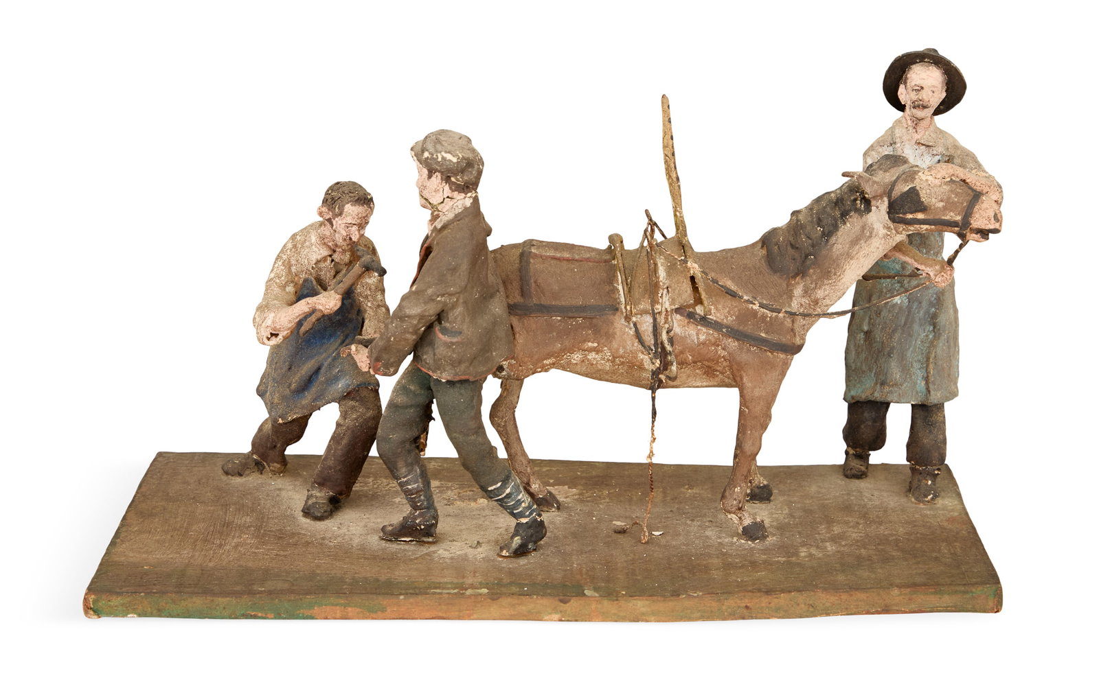 Italian Figural Group of Shoeing the Donkey: Italian Figural Group of Shoeing the Donkey early 20th century, composed of painted wood, metal and papier-mache. h. 7-3/4", w. 13-1/4", d. 6-1/2" Provenance: The collection of Clarence G. Ochsner, Wa