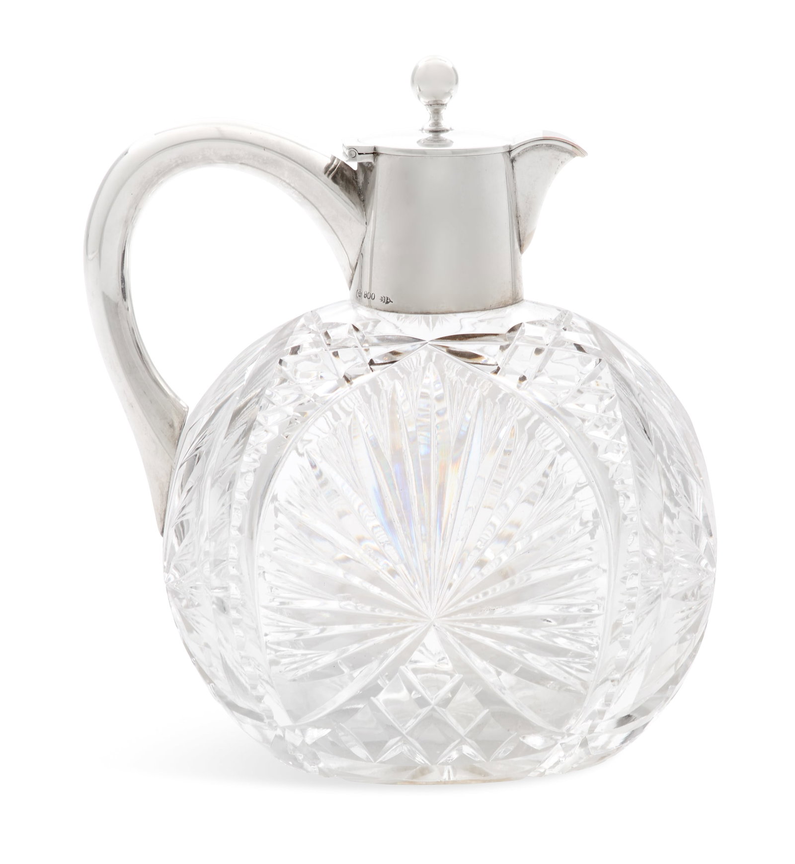 German Silver and Cut-Glass Claret Jug: German Silver and Cut-Glass Claret Jug first quarter 20th century, Hugo Boehm, Schwaebisch-Gmuend, .800 silver, the flattened spherical glass body cut with feathered fans above and between open