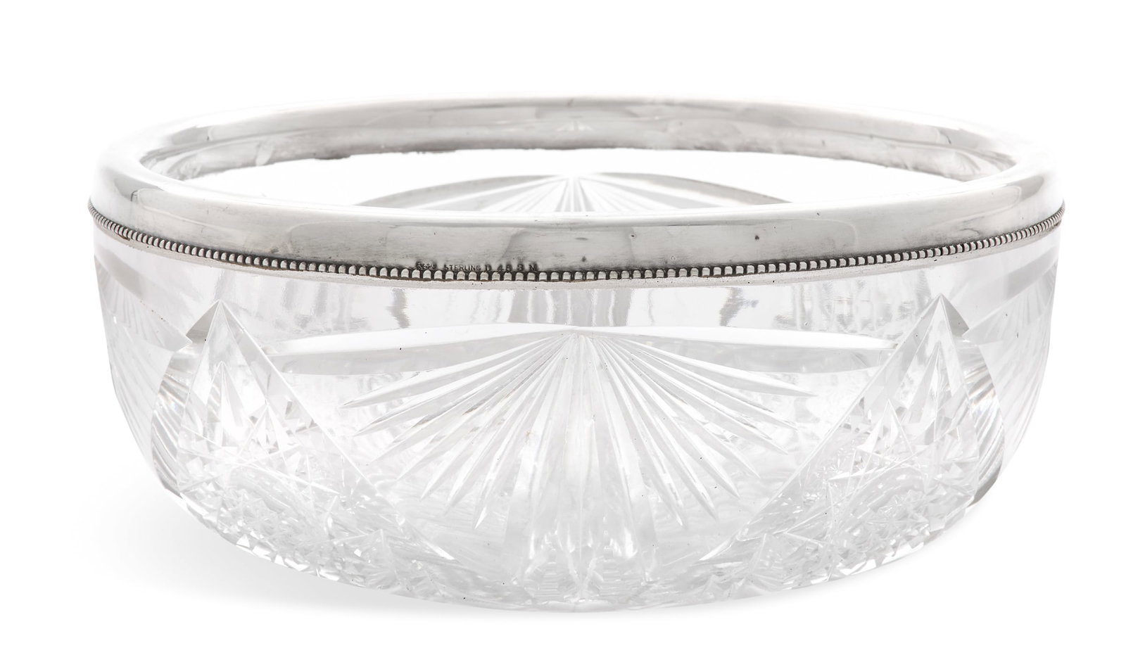 Sterling Silver-Mounted Cut-Glass Bowl: Sterling Silver-Mounted Cut-Glass Bowl ca. 1900, the silver by Gorham, Providence, Rhode Island, the glass Hoare or Hope, the bowl cut with fans and hosbstars, the silver rim with a beaded edge. dia.