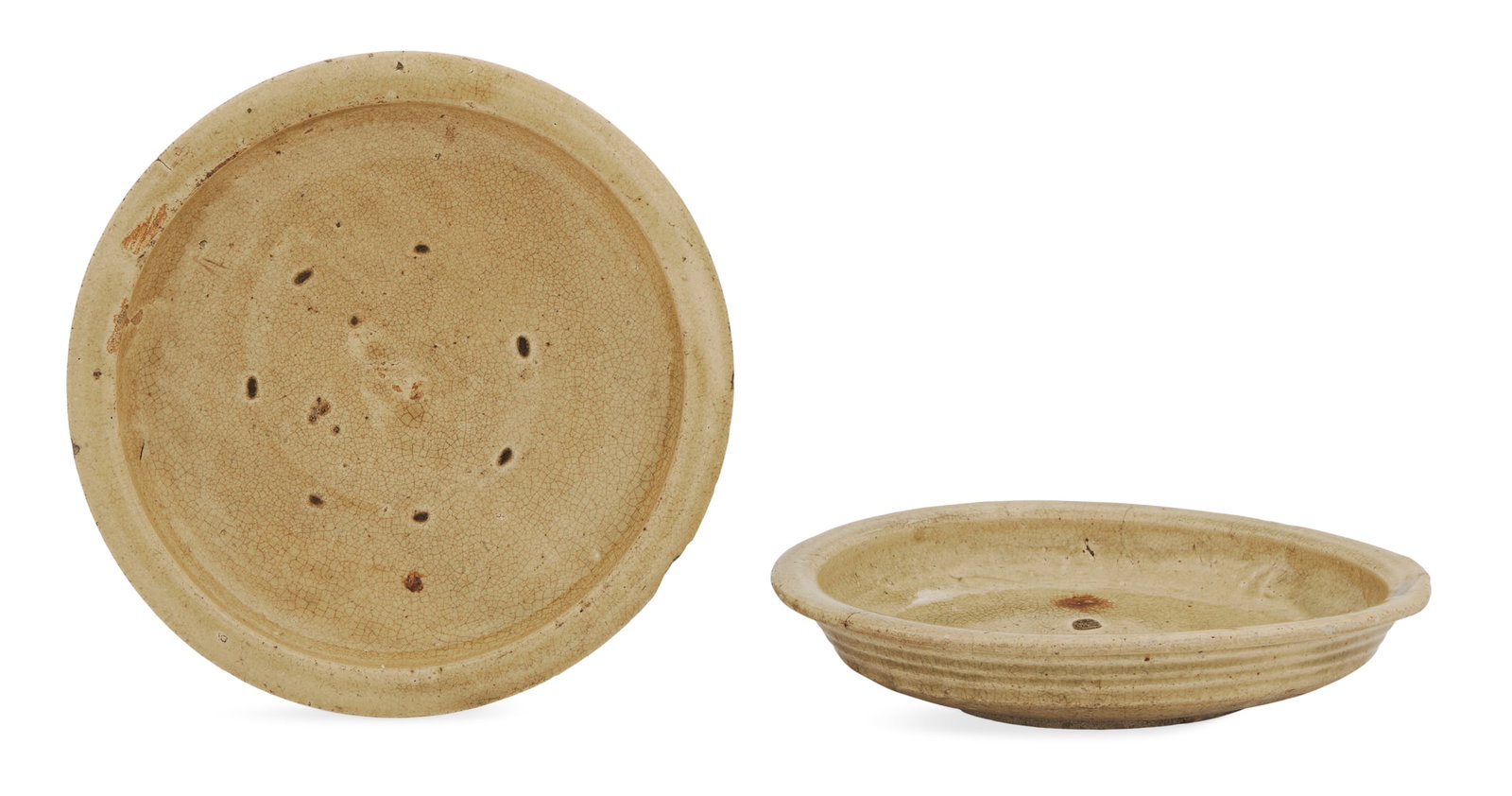 Two Similar Japanese Seto Ware Ishizara: Two Similar Japanese Seto Ware Ishizara Edo Period (1603-1868), each with a creamy celadon glaze, the utilitarian food dishes with stilt marks on the bodies, and ring-turned sides. dia. 13-3/4"