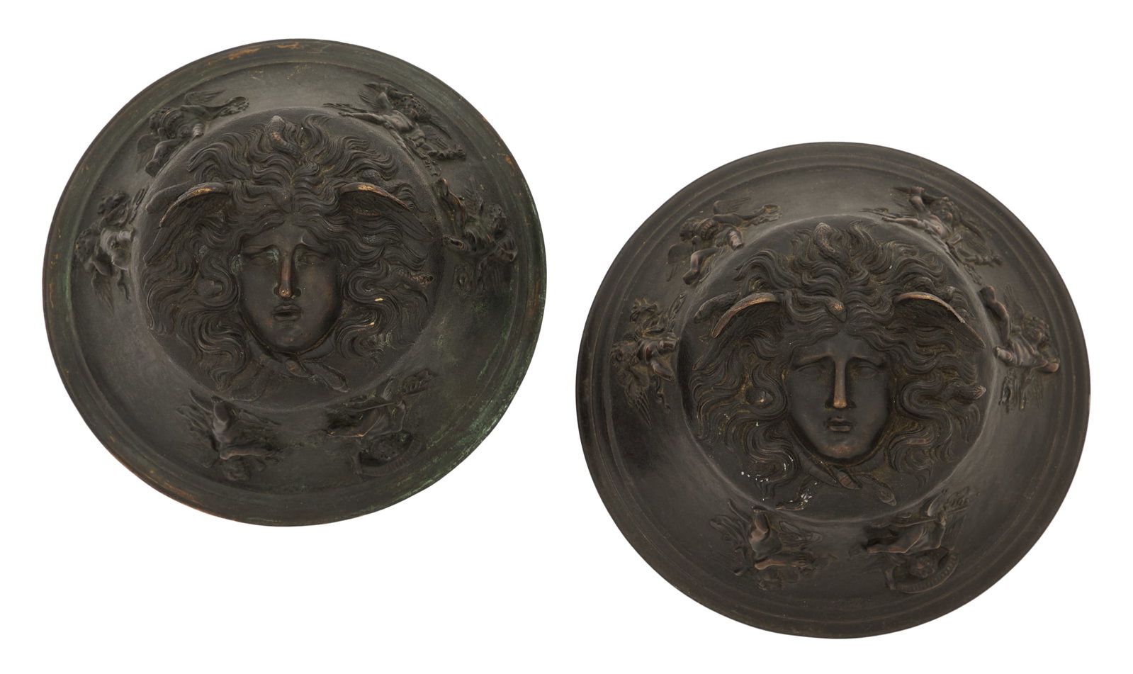 Pair of Italian Grand Tour Table Sculptures: Pair of Italian Grand Tour Table Sculptures late 19th century, the patinated bronze bell-form sculptures with portraits of Medusa, framed with various cherubs on the sides. h. 4-1/4", dia. 8-3/4"