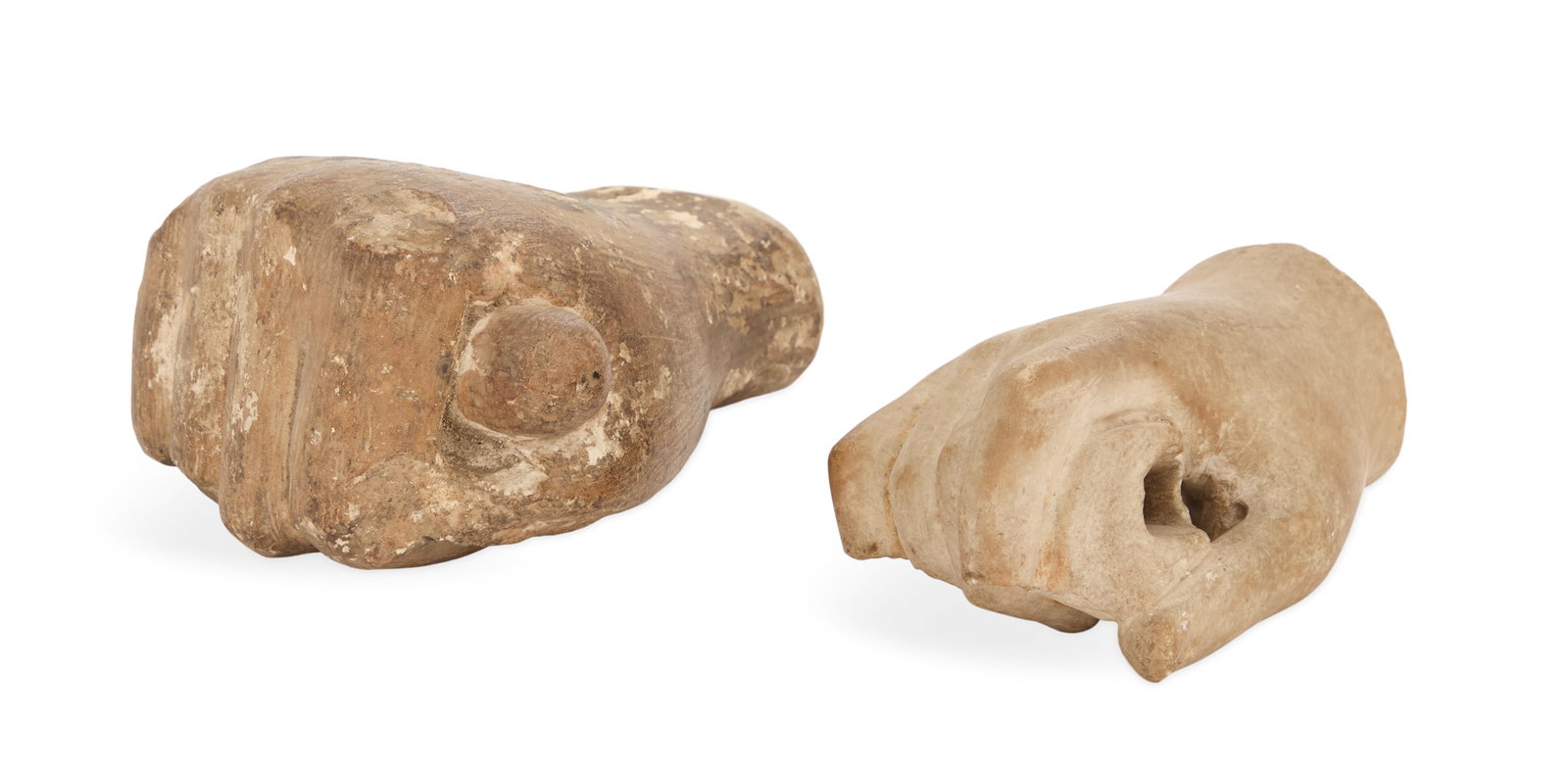 Two Sculpted Hands: Two Sculpted Hands 19th century or earlier, the larger plaster example grasping a baton, h. 5-3/4", w. 4-1/2", d. 3", and the smaller marble example holding a pierced object, h. 2-1/2", w. 3-1/2", d. 