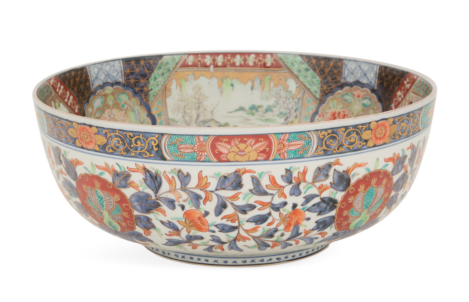 Large Japanese Imari Punch Bowl: Large Japanese Imari Punch Bowl ca. 1900, the exterior decorated in the round with peacocks and orange and cobalt flowering vines, the sides of the interior decorated with panels of landscapes and fig