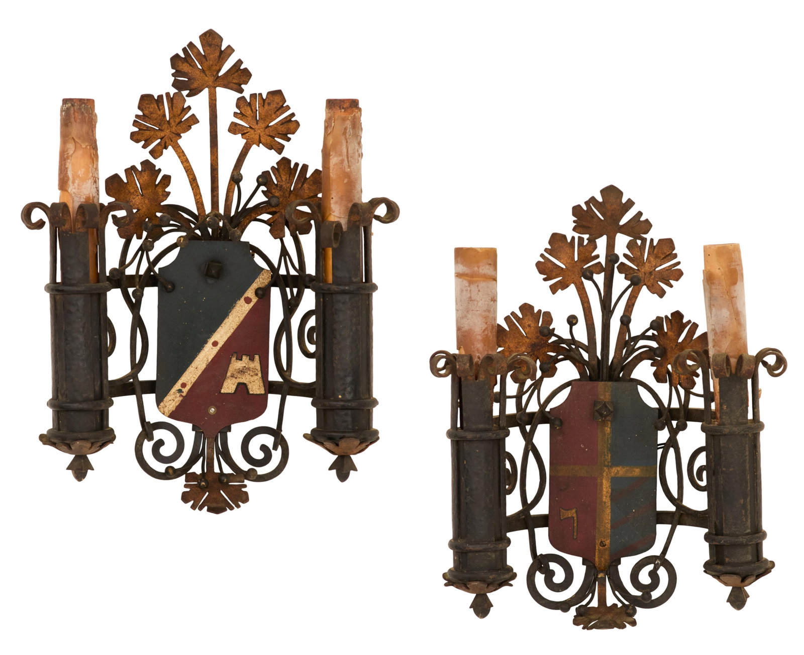 Pair of Enameled Sconces in the Baronial Taste: Pair of Enameled Sconces in the Baronial Taste early 20th century, the enameled shield-form backplates against a ground of scrollwork and metal flowers, set with a pair of tubular candle holders termi